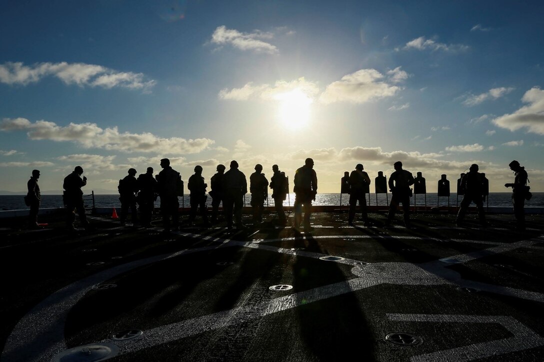 U.S. Marines with the 15th Marine Expeditionary Unit's Maritime Raid Force shoot at targets during Composite Training Unit Exercise (COMPTUEX) aboard the USS Anchorage (LPD 23) off the coast of San Diego March 23, 2015. The 15th MEU's MRF Marines constantly sharpen their skills with different weapon systems to maintain a high level of readiness. (U.S. Marine Corps photo by Sgt. Jamean Berry/Released)