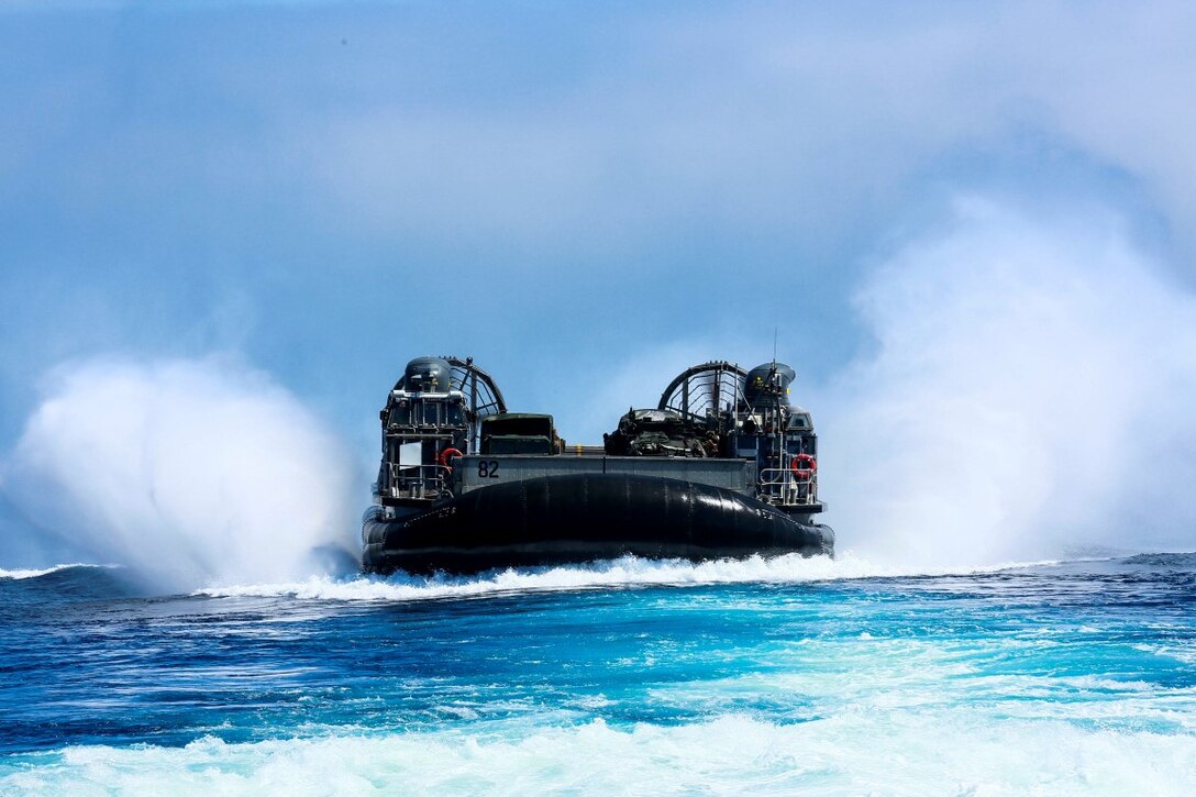 U.S. Navy Landing Craft, Air Cushioned 82 with Assault Craft Unit 5,  races over the ocean during Composite Training Unit Exercise (COMPTUEX) off the coast of San Diego March 23, 2015 LCACs are utilized to transport vehicles, personnel and cargo between the ships of the Essex Amphibious Ready Group and the shore. (U.S. Marine Corps photo by Sgt. Jamean Berry/Released)