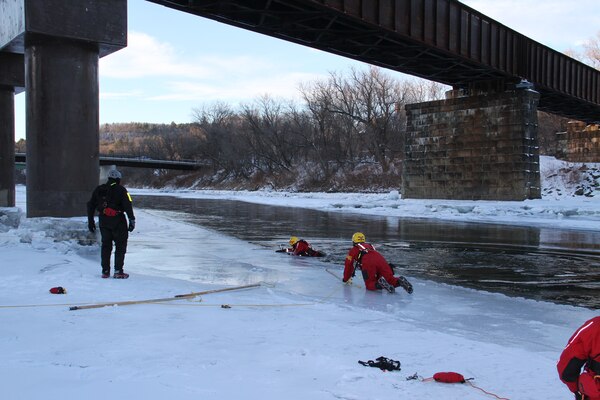 A new component of this year’s Advanced Oil Spill Response Training was an ice safety and self-rescue taught by Rescue Canada Resource Group. This training provided each student a freezing dip in the White River. In this photo, instructors guide a student on a self rescue effort. 