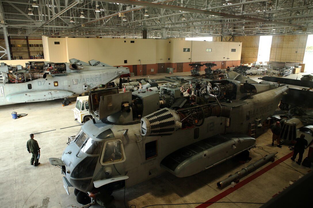 Two CH-53E Super Stallion helicopters sit in pieces in Hangar 101 March 17, 2015, while they are cleaned for an upcoming inspection later this month. Marines attached to Marine Heavy Helicopter Squadron 463 prepared five aircraft to send to Marine Rotational Force Darwin, Australia later this year. It takes 1,500 man-hours per aircraft to make the aircraft inspection-ready.