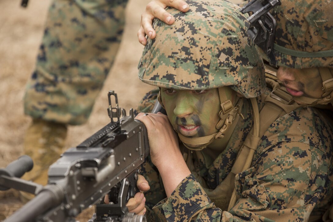 Lance Cpl. William A. Morris, a rifleman with Alpha Company, 1st Battalion, 2nd Marine Regiment looks through the sight of his M240B machine gun during the battalion’s field exercise aboard Camp Lejeune, N.C., March 4, 2015. Squad leaders conducted drills throughout the exercise to ensure the proper employment of the weapon systems. (U.S. Marine Corps photo by Lance Cpl. Olivia McDonald/Released)