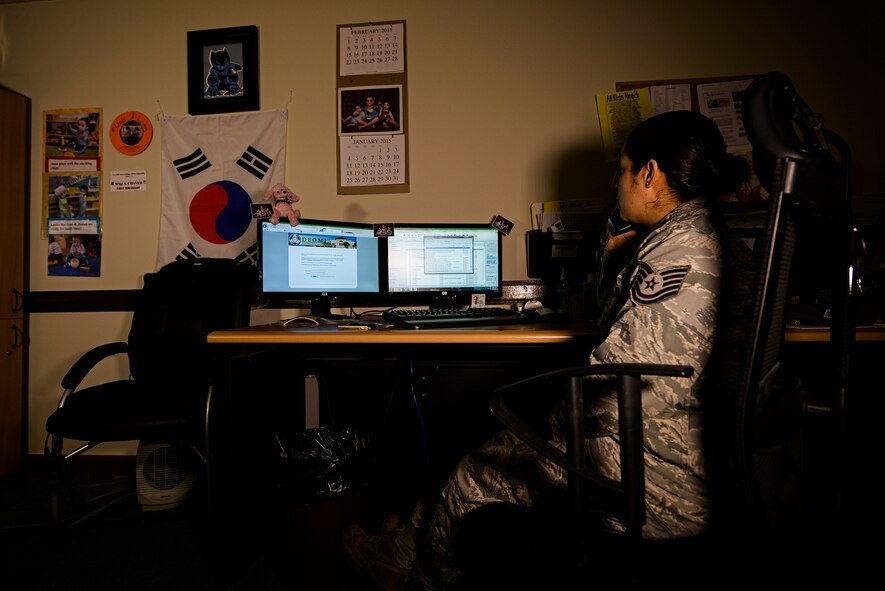 Tech. Sgt. Alejandra Chavez, non-commissioned officer in charge of Equal Opportunity, speaks on the phone with a customer Feb. 27, 2015, at Osan Air Base, Republic of Korea. EO not only handles complaints, but also has means of proactively and reactively ensuring the working climate on stays remains professional and fair. (U.S. Air Force photo by Staff Sgt. Jake Barreiro)