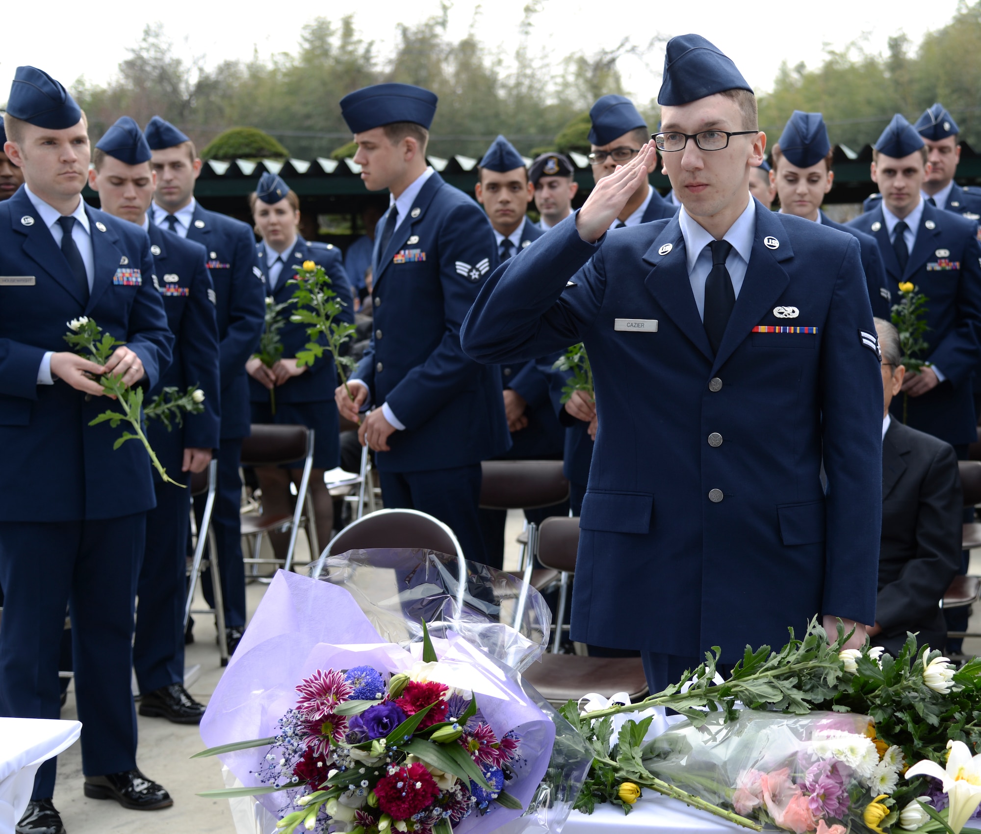 Airman 1st Class Kyle Cazier, 374th Maintenance Squadron aerospace propulsion apprentice, renders a salute to the fallen Airmen at the B-29 memorial ceremony in Gunma Prefecture, Japan, March, 21, 2015. “I was excited to participate in the ceremony and I didn’t know what to expect,” Cazier said. “I feel like the peace we have now is what people back then would have wanted. I greatly appreciate what they fought for and what they went through.” (U.S. Air Force photo by Senior Airman Michael Washburn/Released)