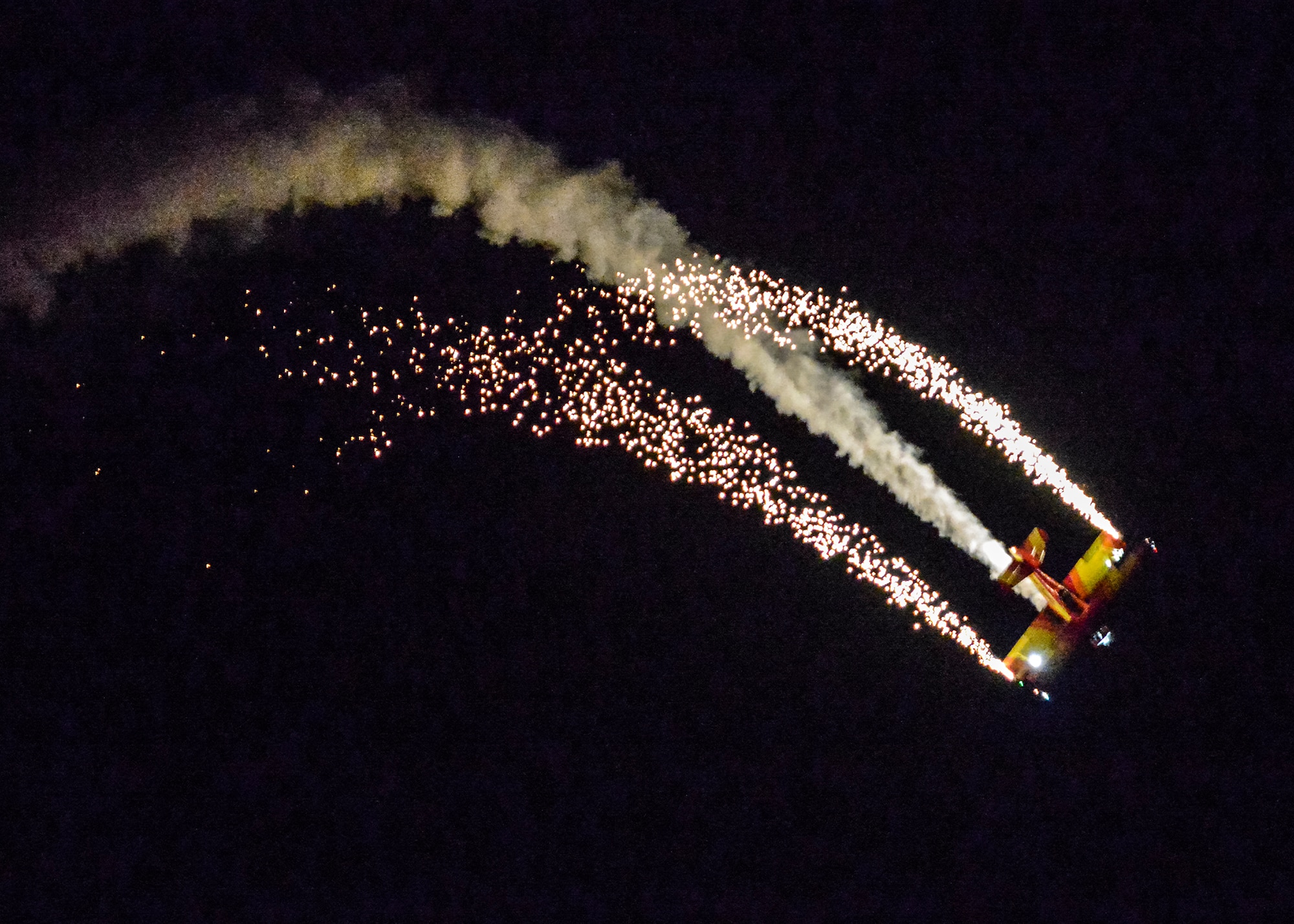 Aerobatic pilot Gene Soucy, better known as “Mr. Airshow,” lit up the sky during the pyrobatic night show during the 2015 L.A. County Air Show kickoff event March 20 at the Antelope Valley Fairgrounds. (U.S. Air Force photo by Rebecca Amber)