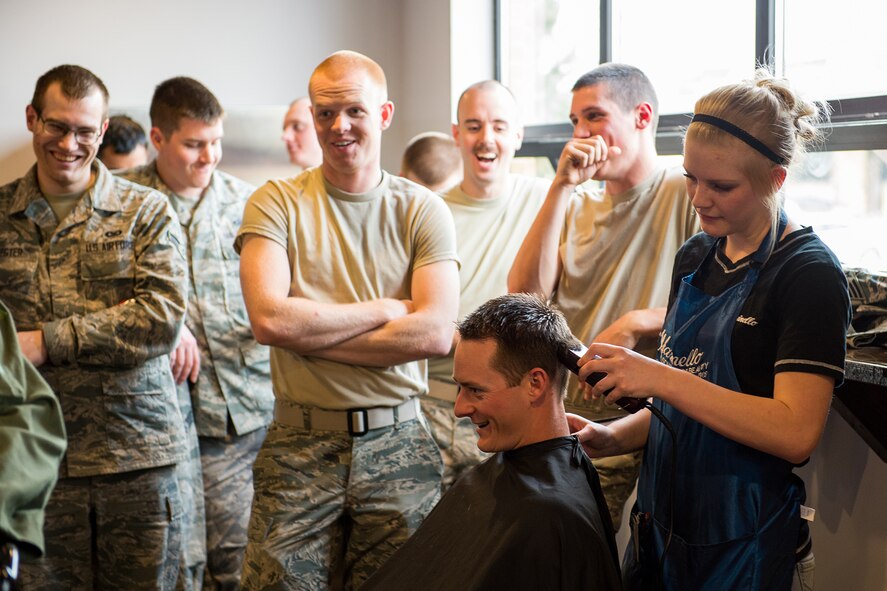 Approximately 80 Airmen from the 388th and 419th Fighter Wings shaved their heads March 23 in support of Gracelyn and all those affected by childhood cancer. (U.S. Air Force photo by R. Nial Bradshaw).