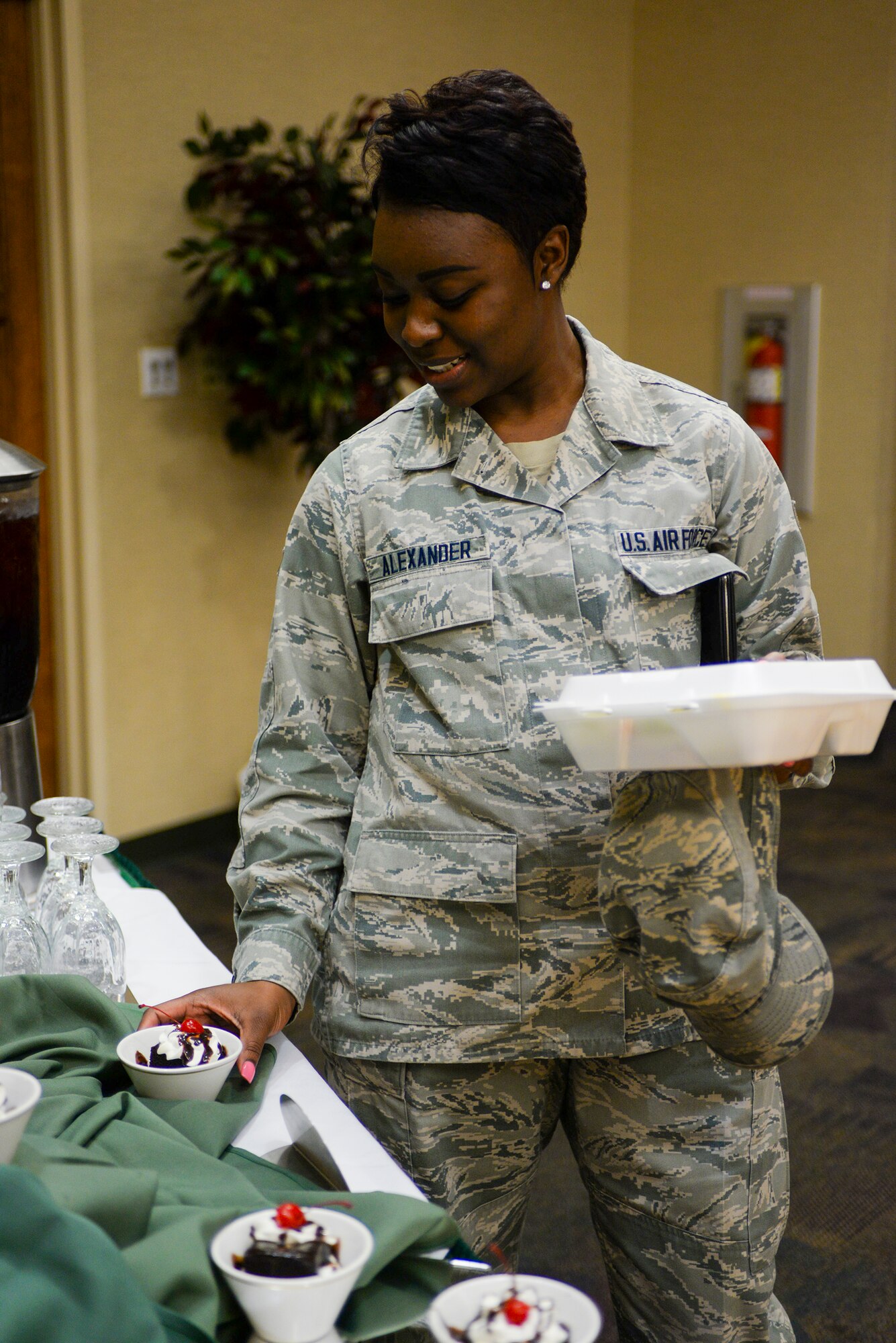 U.S. Air Force Airman 1st Class Kiandra Alexander, 23d Logistics Readiness Squadron travel management office journeyman, gets chocolate pudding during the Luck of the Irish Lunch Buffet March 18, 2015, at Moody Air Force Base, Ga. The Moody Field Club had an Irish-themed lunch to celebrate the holiday. (U.S. Air Force photo by Senior Airman Sandra Marrero/Released)
