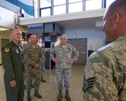 Staff Sgt. Joseph Rucker, passenger services supervisor for the 735th Air Mobility Squadron, briefs Lt. Gen. Carlton D. Everhart II, 18th Air Force commander, Chief Master Sgt. Robert Rodewald , 18th Air Force Command Chief and  Maj. Gen. Frederick Martin, Commander, U.S. Air Force Expeditionary Center, in the Air Mobility Command passenger terminal on Joint Base Pearl Harbor-Hickam, Hawaii, March 22, 2015. Rucker explained the three phases of the planned renovations to the passenger terminal and how the renovations will improve efficiency and comfort for passengers.  The renovations are scheduled to begin on Jan. 16, 2016. (U.S. Air Force photo by Tech. Sgt. Aaron Oelrich/Released) 