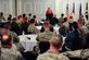 Retired Maj. Roy White, Eagleson Chapter vice president and historian, speaks with Airmen during a heritage luncheon, March 18, 2015, at Seymour Johnson Air Force Base, North Carolina. White highlighted the event as the keynote speaker and shared his account of working with this resilient group of standout Airmen - simply known as the "Red Tails". (U.S. Air Force photo/Senior Airman Brittain Crolley)