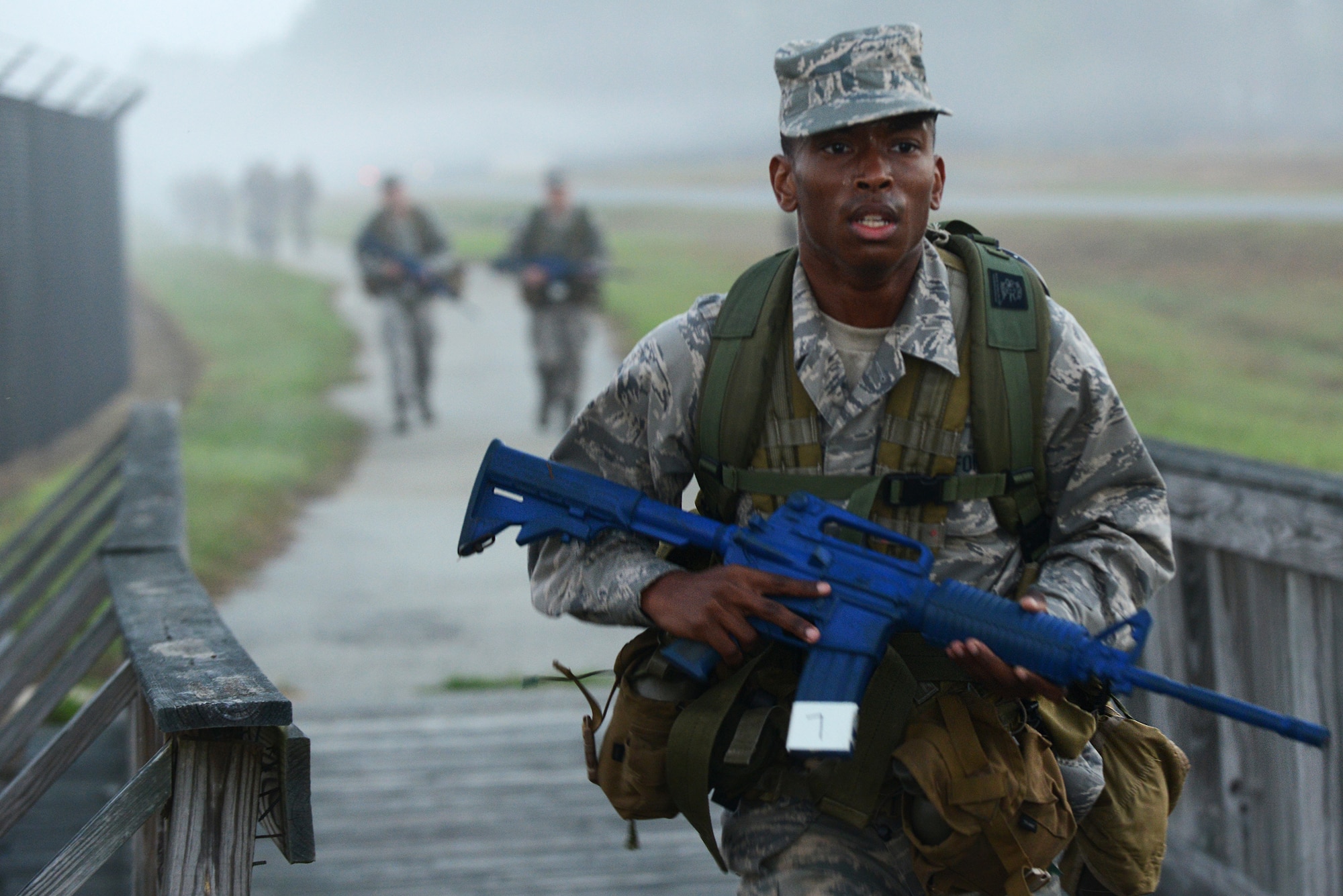 U.S. Air Force Reserve Officers’ Training Corps Cadet John Carr, University of South Florida tactical air control party candidate, runs during a ruck march, March 21, 2015, at Moody Air Force Base, Ga.  The 4-mile ruck fell under the Air Liaison Officer Aptitude Assessment for candidates striving to join the TACP career field. (U.S. Air Force photo by Airman 1st Class Kathleen D. Bryant/Released)