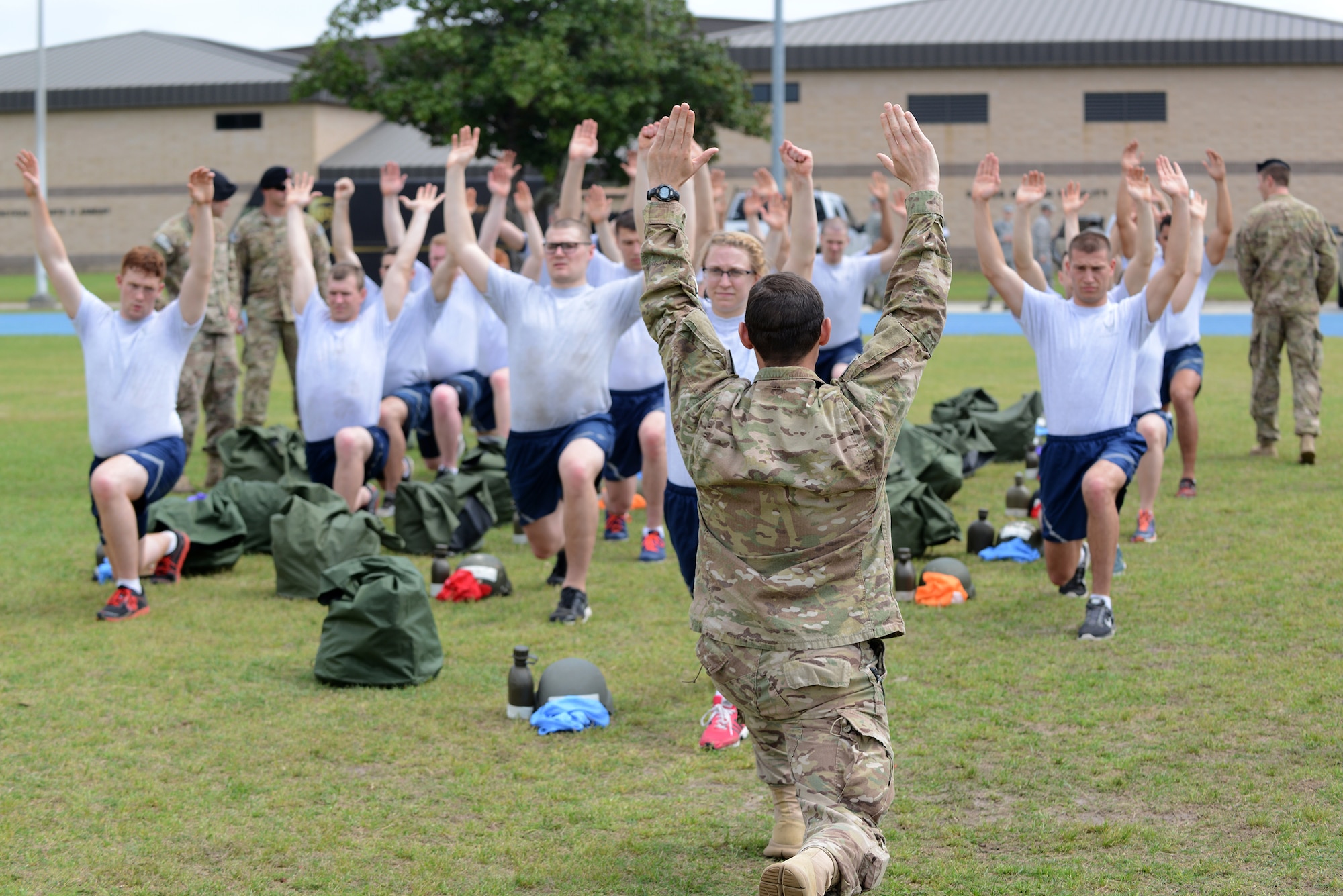 U.S. Air Force Master Sgt. Steve Reedy, 13th Air Support Operations Squadron flight chief, leads tactical air control party candidates in stretching before the physical ability and stamina test March 20, 2015, at Moody Air Force Base, Ga. The PAST launched the week long Air Liaison Officer Aptitude Assessment for the tactical air control party candidates. (U.S. Air Force photo by Airman 1st Class Kathleen D. Bryant/Released)