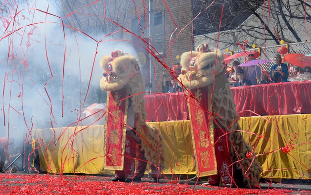 Lion dancers hold up Chinese New Year banners during the Bok Kai Festival in Marysville, Calif., Mar. 21, 2015. The festival has been held in Marysville for 135 years. (U.S. Air Force photo by Staff Sgt. Robert M. Trujillo/Released)