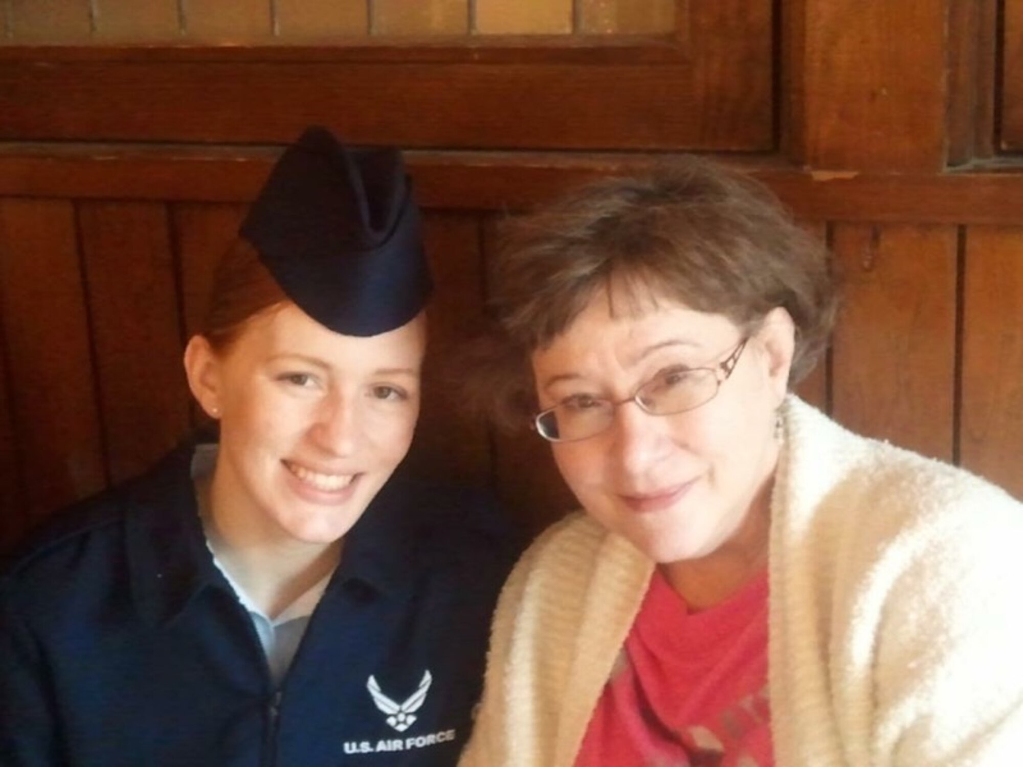 Then Airman 1st Class Lauren E. Parsons and her mother, Elizabeth Jones, pose for a photo in San Antonio, Texas, after Parsons graduated from Basic Military Training, Dec. 17, 2011. Parsons, who is now a senior airman and assigned to the 66th Comptroller Squadron as a customer service technician, lost her mother unexpectedly 10 weeks later and used the Air Force Aid Society to attend her funeral and handle arrangements. (Courtesy photo)