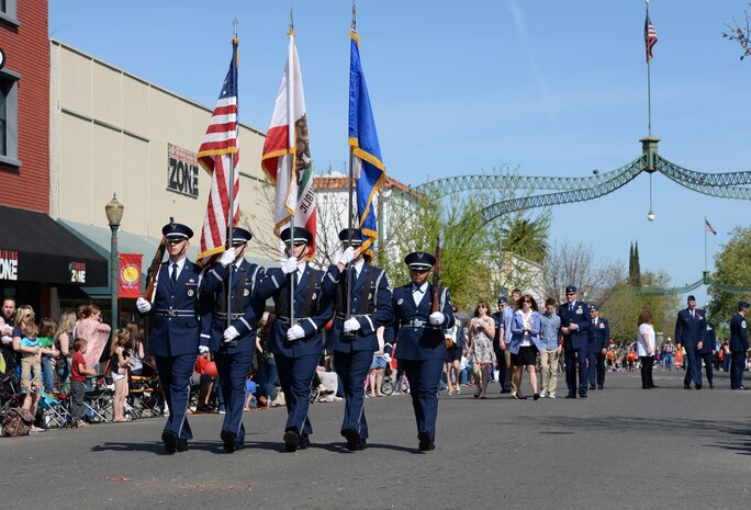 Beale Air Force Base Honor Guard and 9th Reconnaissance Wing leadership participate in the Bok Kai Festival in Marysville, Calif., Mar. 21, 2015. The event featured a variety of floats, cultural performances and the Bok Kai parade dragon. (U.S. Air Force photo by Staff Sgt. Robert M. Trujillo/Released)