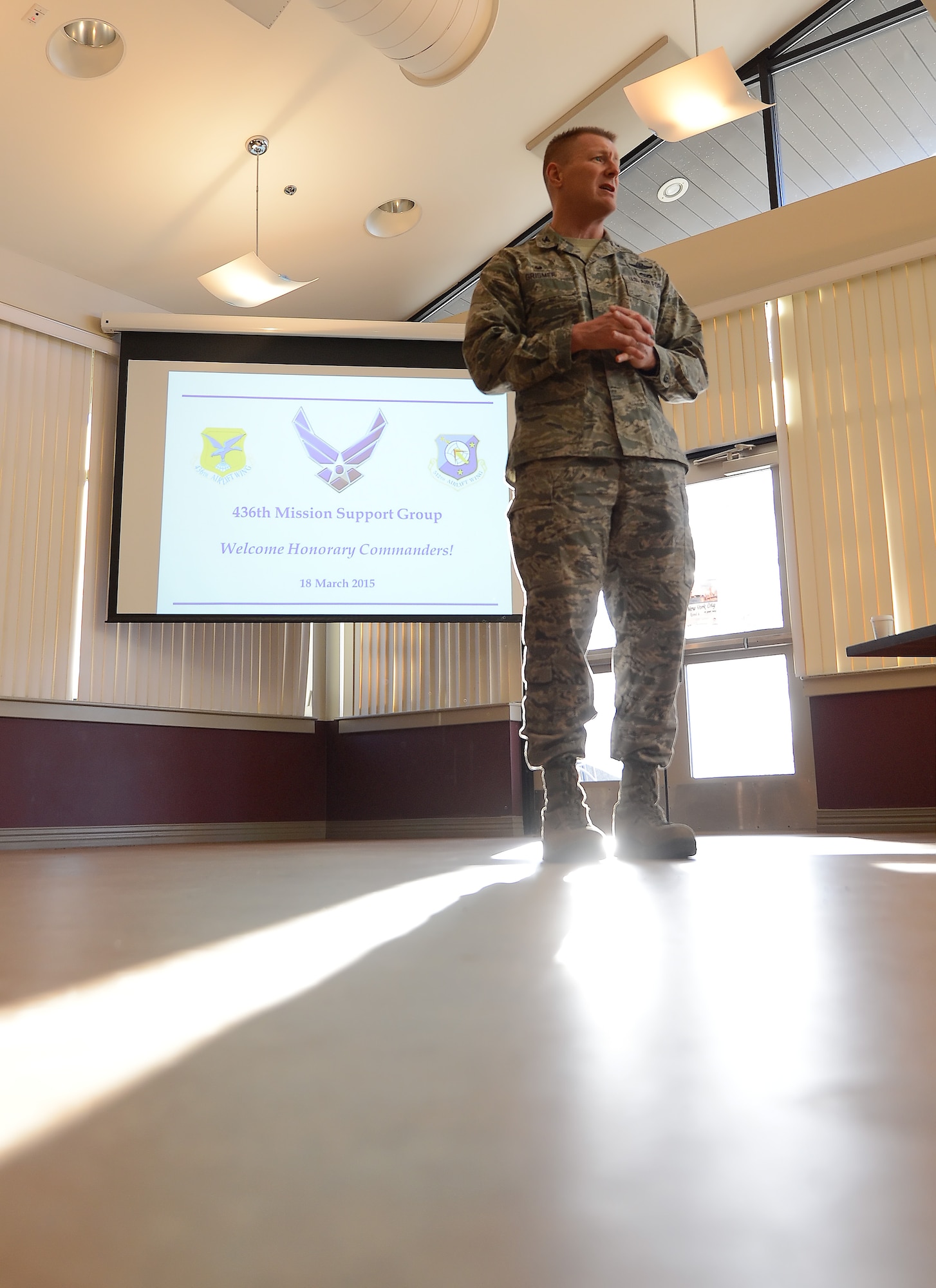 Col. Michael Grismer, 436th Airlift Wing commander, welcomes the 2015 Honorary Commanders at Mulligan's Club House for a tour of the 436th Mission Support Group March 18, 2015, on Dover Air Force Base, Del. Grismer introduced the honorary commanders to the MSG leadership and overall mission. (U.S. Air Force photo/Greg L. Davis)