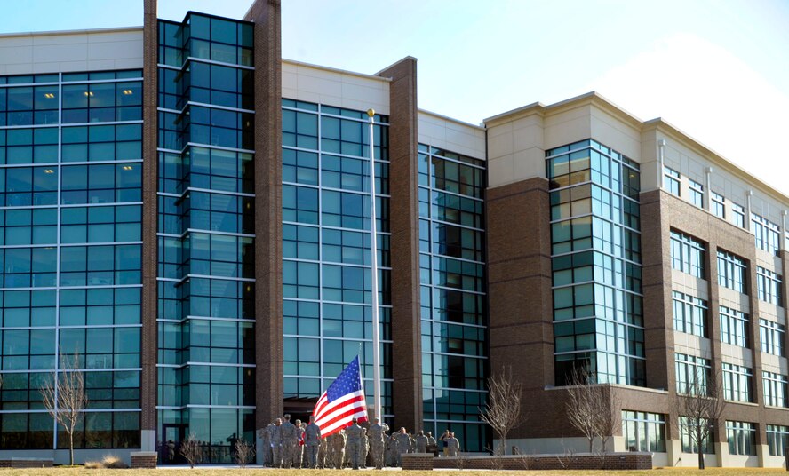 Airmen from the Air Force District of Washington gather to retire a flag during a retreat ceremony in front of the William A. Jones III Building on Joint Base Andrews, Md. March 23, 2015. Flags are properly honored and retired when they are no longer fit to be on display. (U.S. Air Force photo/Michael Martin)