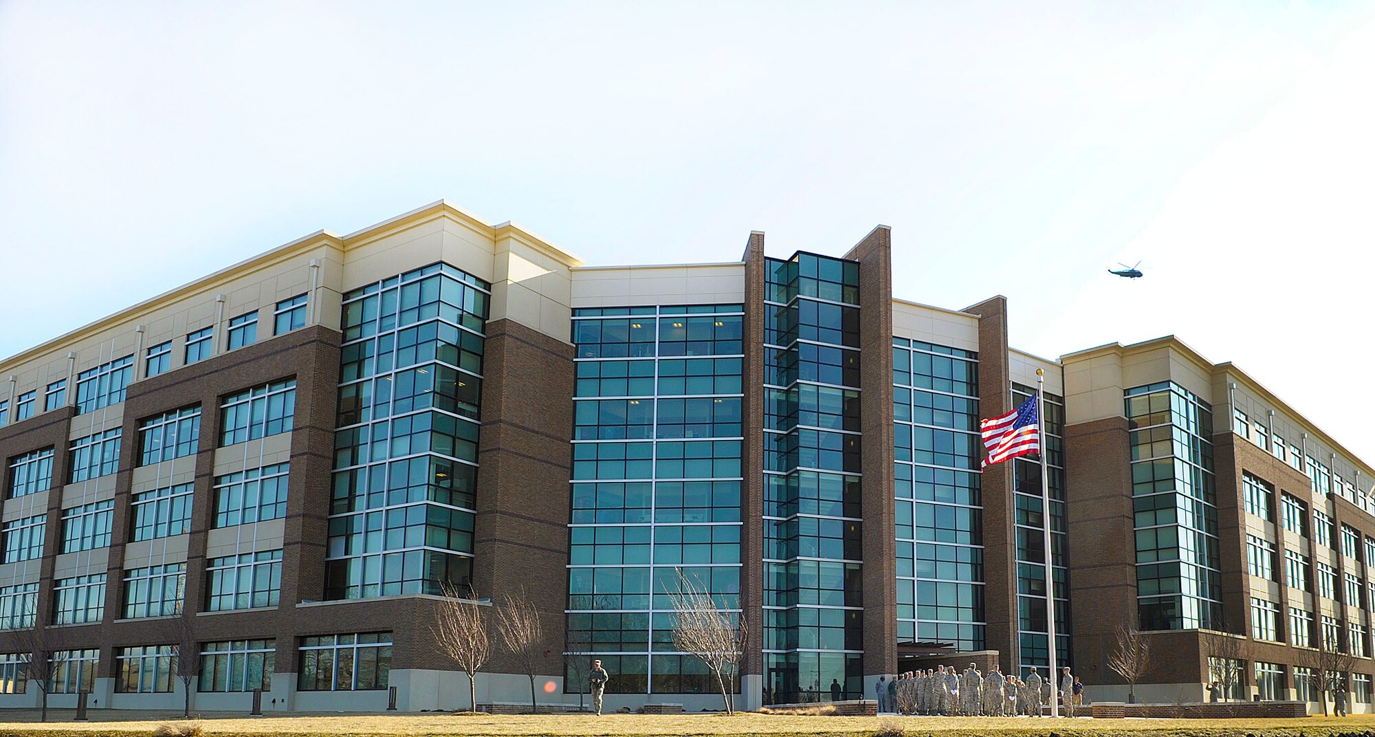 Airmen from the Air Force District of Washington gather to retire a flag during a retreat ceremony in front of the William A. Jones III Building on Joint Base Andrews, Md. March 23, 2015. Flags are properly honored and retired when they are no longer fit to be on display. (U.S. Air Force photo/Michael Martin)