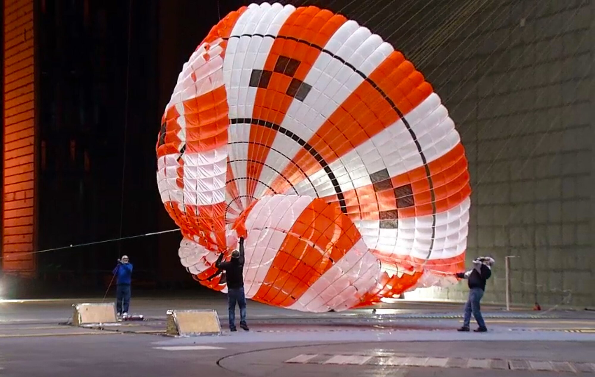 AEDC engineers were part of a test team that performed wind tunnel testing on the parachutes for NASA Orion spacecraft in January. The test team also consisted of NASA, Airborne Systems, Jacobs Engineering and NFAC personnel. Pictured here is a parachute being tested in a NFAC wind tunnel. (AEDC photos) 