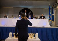 U.S. Air Force Brig. Gen. Christopher Short, 57th Wing Commander, salutes Col. Chad Franks, 23d Wing commander and president of the mess, before drinking from the traditional grog bowl during the 2nd Annual Dining-In March 20, 2015, at Moody Air Force Base, Ga. Short is Moody’s former 23d WG vice commander and was the guest speaker for the event. (U.S. Air Force photo by Airman 1st Class Ceaira Tinsley/Released)
