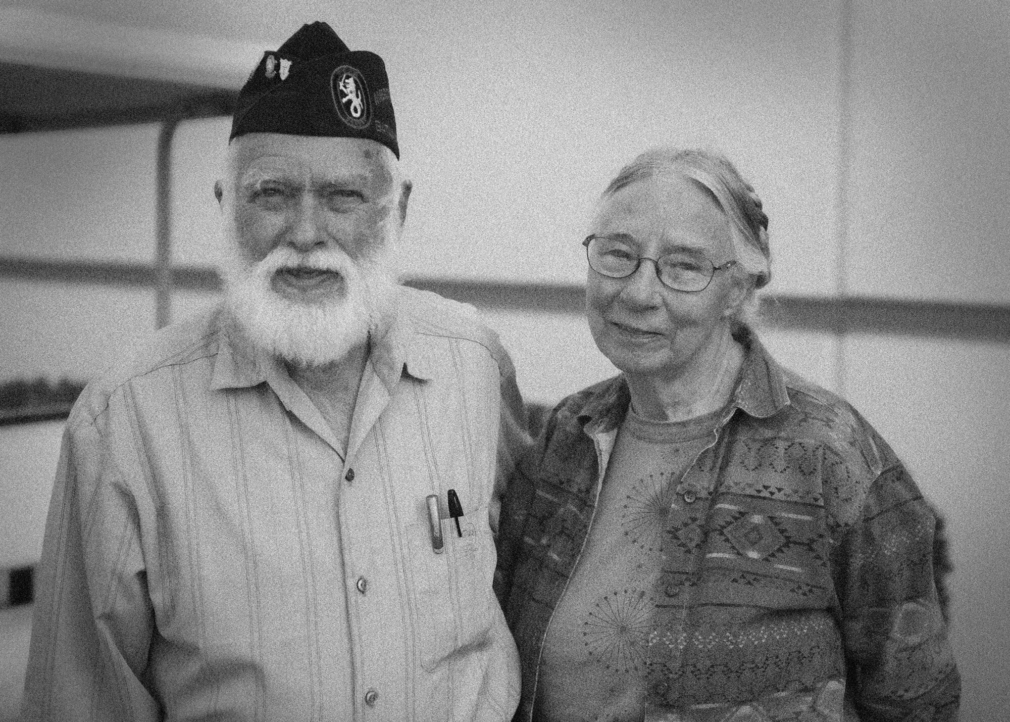 Oscar Leonard, a Bataan Death March survivor, poses for a photo with his wife at the Post Theater, White Sands Missile Range, N.M. March 21, 2015. More than 6,000 people came out this year for the 14.2 or 26.2-mile march to honor the more than 75,000 prisoners of war, and those who were killed during the Bataan Death March in 1942. "I feel humbled to see all the work that people put into making this event possible to honor us," said Leonard. "I always look forward to coming to the Bataan and seeing fellow survivors, it gives us all the opportunity to enjoy each other's company along with sharing in the moment of what this event means to all of us." (U.S. Air Force photo by Airman 1 Class Emily A. Kenney/Released)
