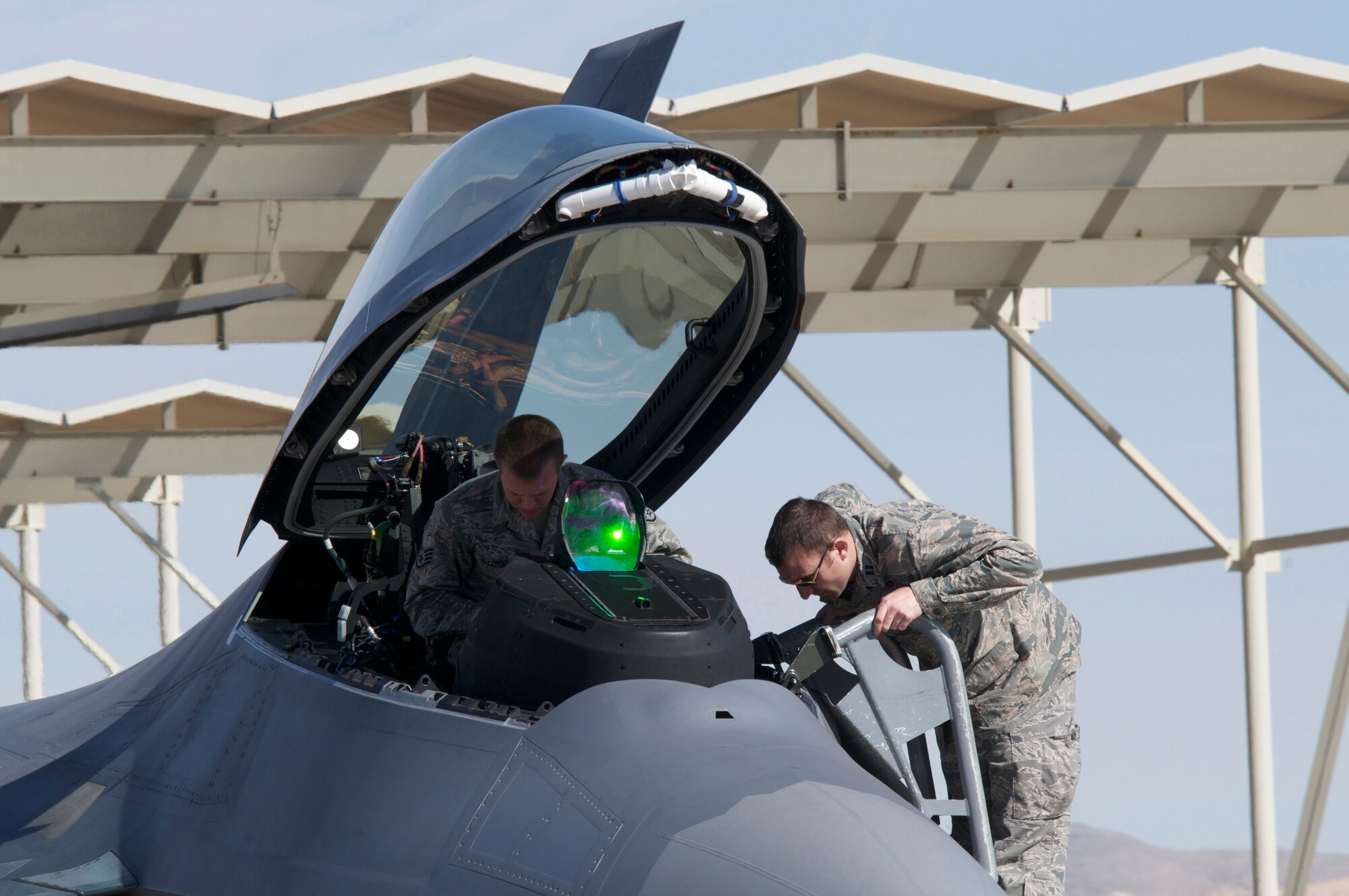 F-22A Raptor aircraft maintainers from the 192nd and 1st Fighter Wings, Langley Air Force Base, Va., participate in 40th anniversary of the Red Flag combat training exercise, Red Flag 15-1 at Nellis Air Force Base, Nev., Feb. 3, 2015.  Red Flag is a realistic combat training exercise designed to simulate the first few weeks of a major theater campaign involving air, space and cyber forces of the U.S. and its allies. It is conducted on the bombing and gunnery ranges on the Nevada Test and Training Range. (U.S. Air National Guard photo by Master Sgt. Carlos J. Claudio/Released)