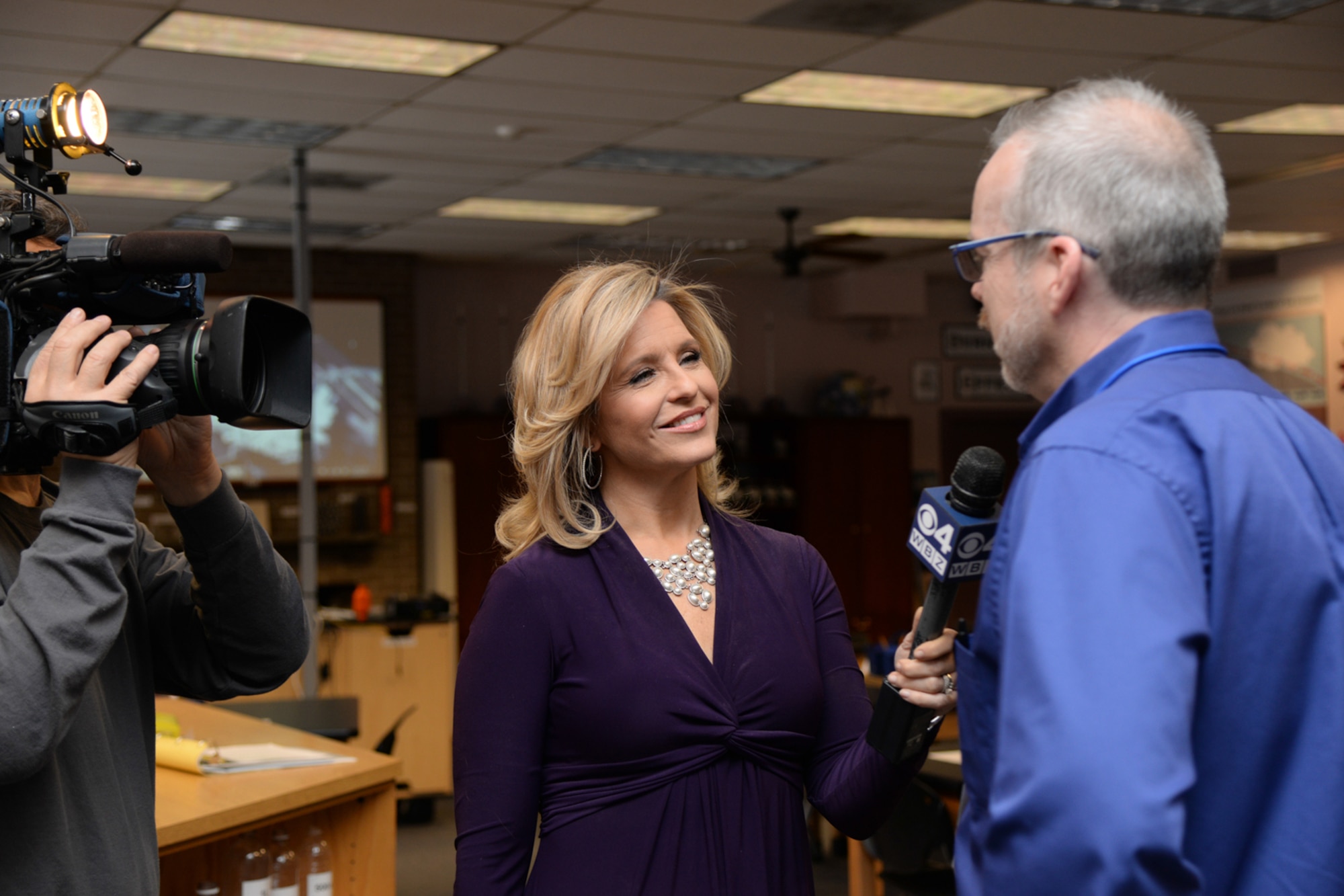 Boston news anchor Paula Ebben, WBZ-TV (CBS), interviews Peter Holden, STARBASE director, at Hanscom Air Force Base, Mass., March 20. The STARBASE Academy at Hanscom is one of more than 50 STARBASE STEM education programs located on military bases across the United States and is a Department of Defense education initiative. (U.S. Air Force photo by Linda LaBonte-Britt)