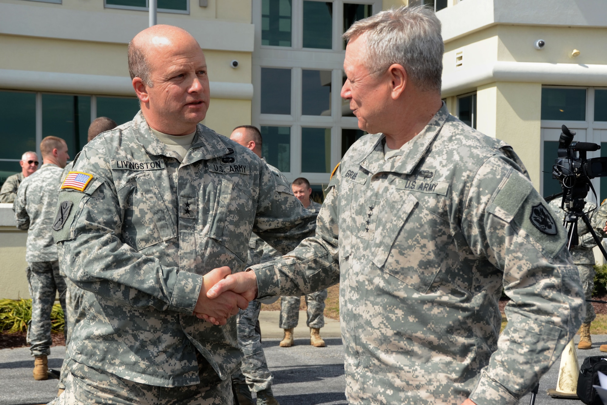 U.S. Army Maj. Gen. Robert E. Livingston Jr. (left), the Adjutant General for the state of South Carolina, shakes hands with Gen. Frank J. Grass, Chief of the National Guard Bureau and a member of the Joint Chiefs of Staff, at the conclusion of a visit conducted to observe integrated military and civilian operations during Vigilant Guard South Carolina, March 9, 2015. Vigilant Guard is a series of federally funded disaster-response drills conducted by National Guard units working with federal, state and local emergency management agencies and first responders. (U.S. Air National Guard photo by Airman 1st Class Ashleigh S. Pavelek/Released)