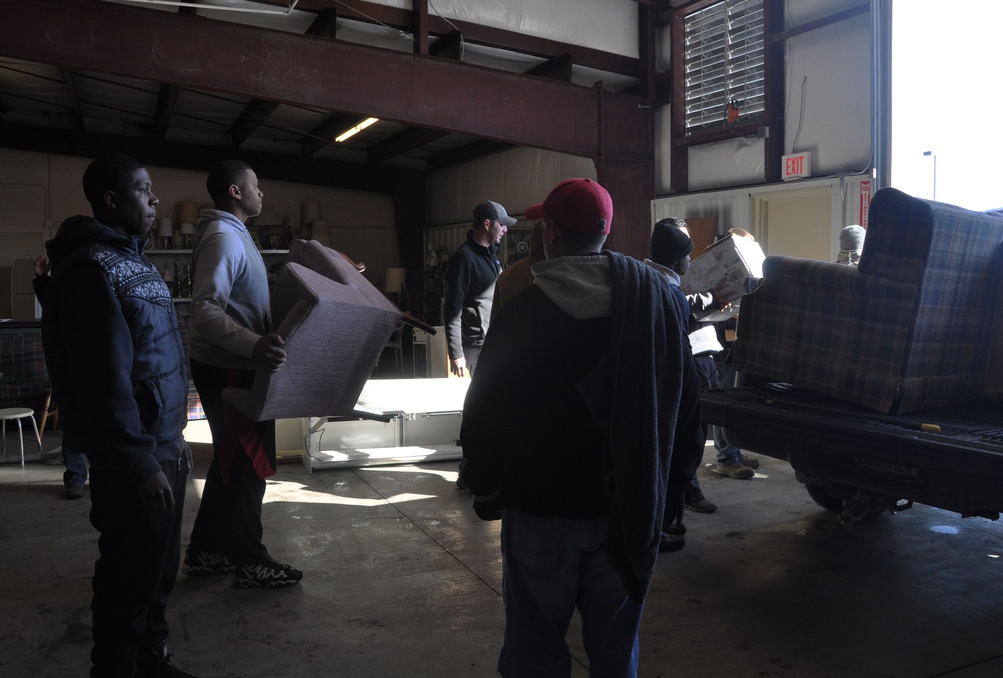 Airmen from McConnell Air Force Base load furniture into a truck at His Helping Hands, a local non-profit that distributes household items to families in need in Wichita, Kan., March 5, 2015. The VA in Wichita works with His Helping Hands to provide household goods for homeless veterans as part of their initiative to end homelessness. (U.S. Air Force photo by Tech. Sgt. Abigail Klein)
