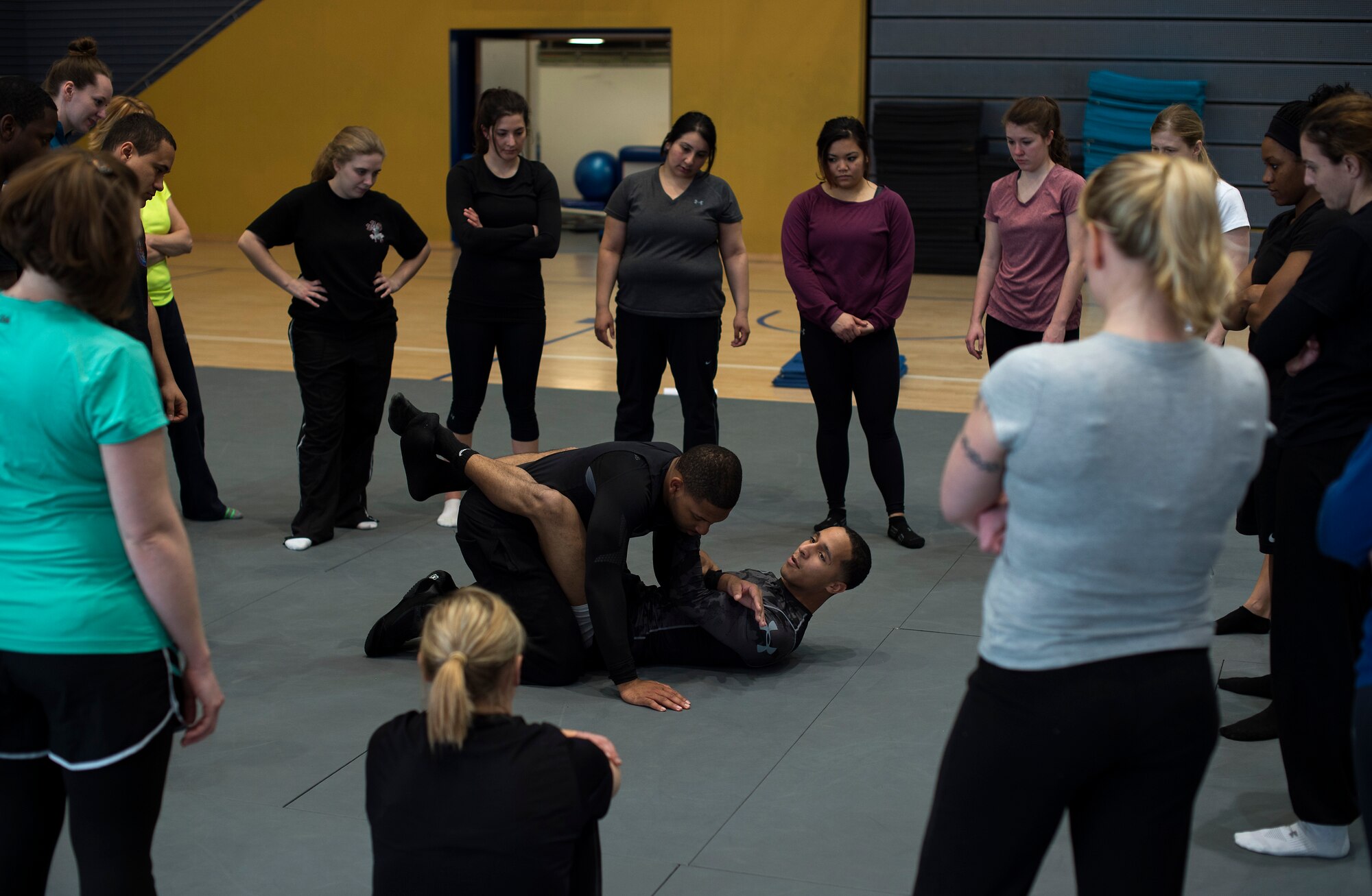 Senior Airmen Stephen Peterson, left, and William Stambaugh, 86th Security Forces Squadron Ravens, demonstrate the guard position during a self-defense seminar at Ramstein Air Force Base, Germany, March 20, 2015. The 86th SFS taught a variety of self-defense moves including punches, kicks and grapples. (U.S. Air Force photo/Senior Airman Damon Kasberg)