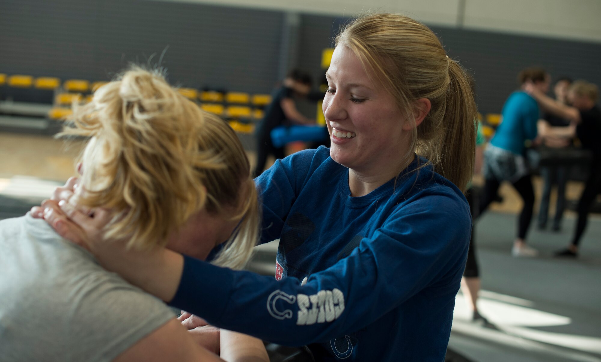 Senior Airman Jessica Hennessee, 86th Communications Squadron theater secure voice systems technician, practices her knee kick during a self-defense seminar at Ramstein Air Force Base, Germany, March 20, 2015. The 86th SFS taught a variety of self-defense moves including punches, kicks and grapples. (U.S. Air Force photo/Senior Airman Damon Kasberg)