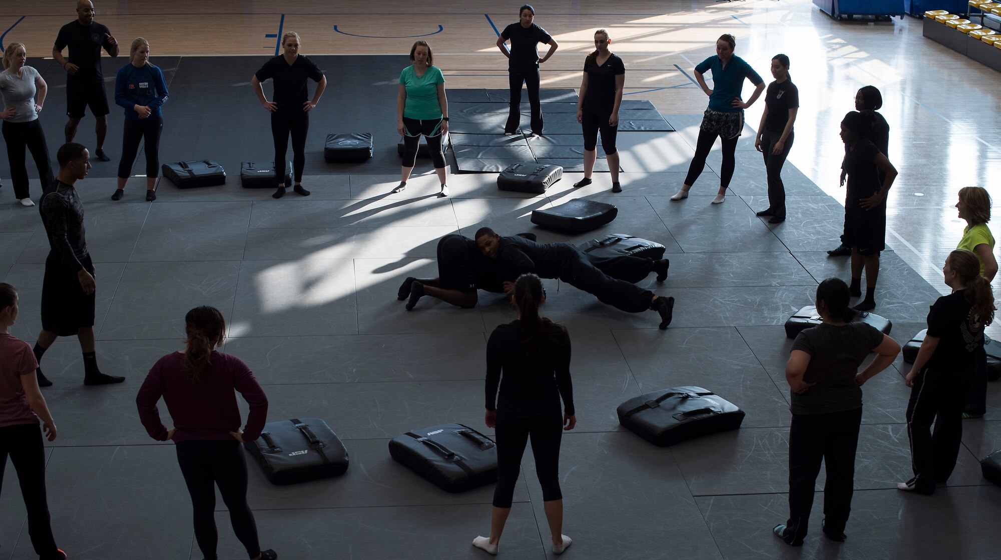 Members of the 86th Security Forces Squadron demonstrate how to avoid being grabbed during a self-defense seminar at Ramstein Air Force Base, Germany, March 20, 2015. The 86th SFS taught a variety of self-defense moves including punches, kicks and grapples. (U.S. Air Force photo/Senior Airman Damon Kasberg)