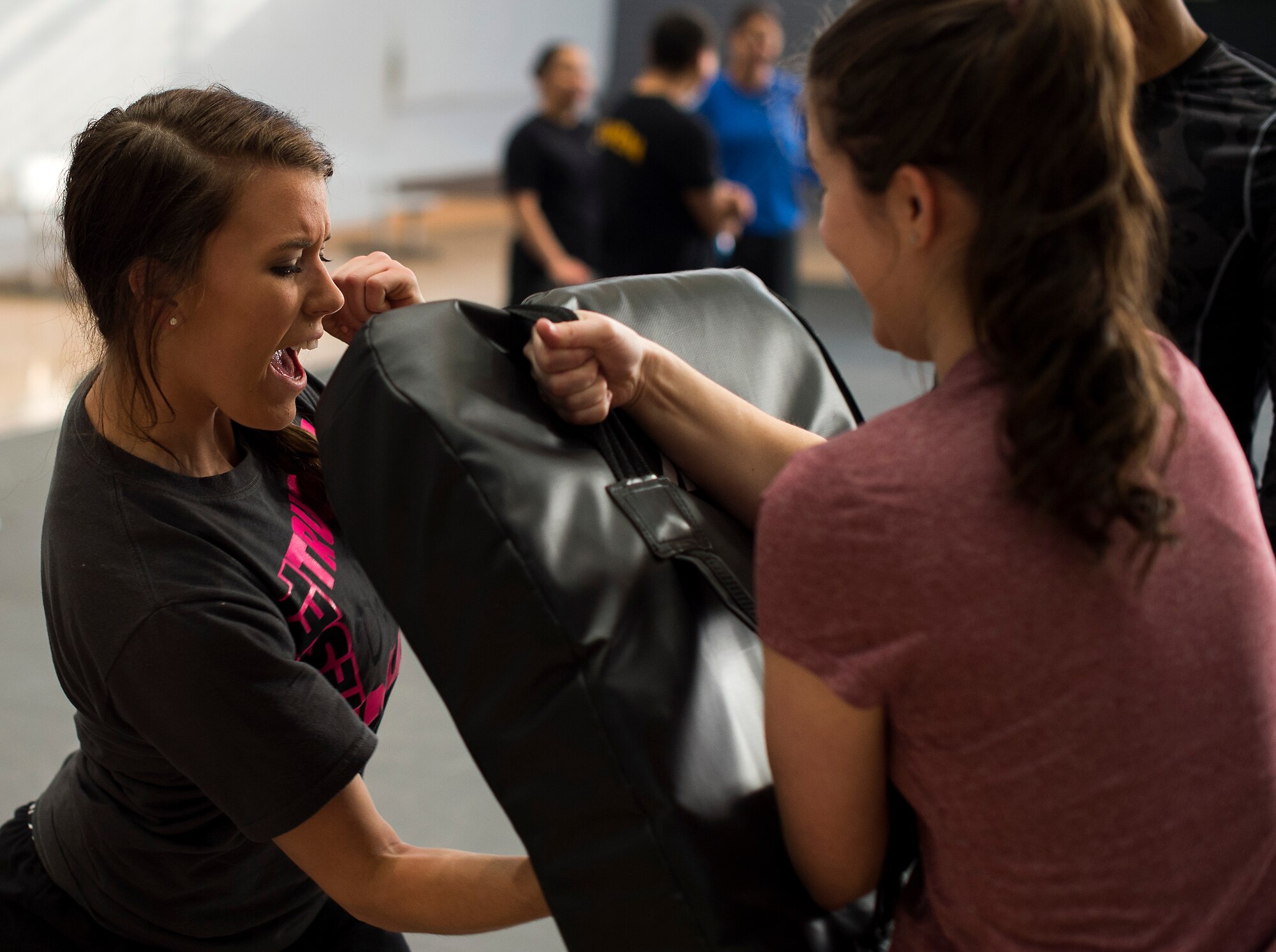 Senior Airman Blair Coffey, 86th Vehicle Readiness Squadron general purpose light mechanic, uppercuts a punching bag during a self-defense seminar at Ramstein Air Force Base, Germany, March 20, 2015. The seminar included self-defense, Taser and home security training and demonstrations. (U.S. Air Force photo/Senior Airman Damon Kasberg)
