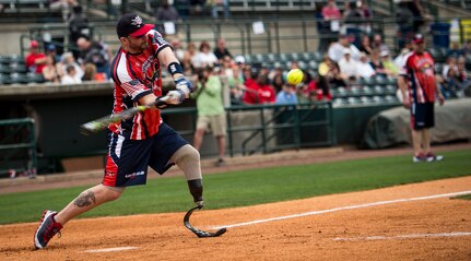 Dan Lasko, Wounded Warrior Amputee Softball Team member, swings at a pitch during the “Battle of Charleston Harbor” softball tournament March 21, 2015, at Joe Riley Stadium in Charleston, S.C. The WWAST is comprised of young, competitive, athletic veterans and active duty soldiers who have lost limbs post-9/11, while serving their country in the military. Some are still in the service, others are attending college thanks to the Post-9/11 GI Bill, while others have moved on to new careers. (U.S. Air Force photo/Airman 1st Class Clayton Cupit)