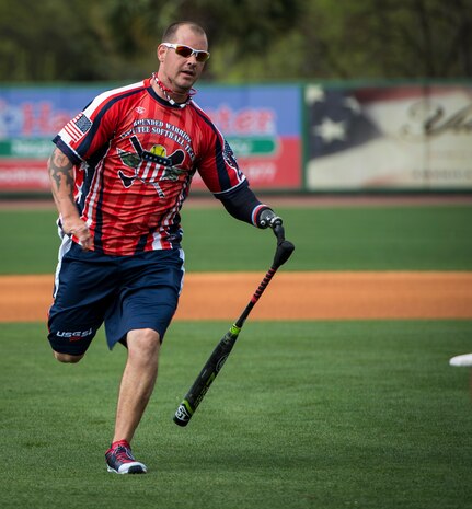Leonard Anderson, Wounded Warrior Amputee Softball Team member, hits an inside-the-park home run during the “Battle of Charleston Harbor” softball tournament March 21, 2015, at Joe Riley Stadium in Charleston, S.C. The mission of the WWAST is to raise awareness, through exhibition and celebrity softball games, of the sacrifices and resilience of our military and highlight their ability to rise above any challenge. Their goal is to show other amputees and the general public, that these athletes, through extensive rehabilitation and training, are able to express their desires and perform the sport they love. (U.S. Air Force photo/Airman 1st Class Clayton Cupit)