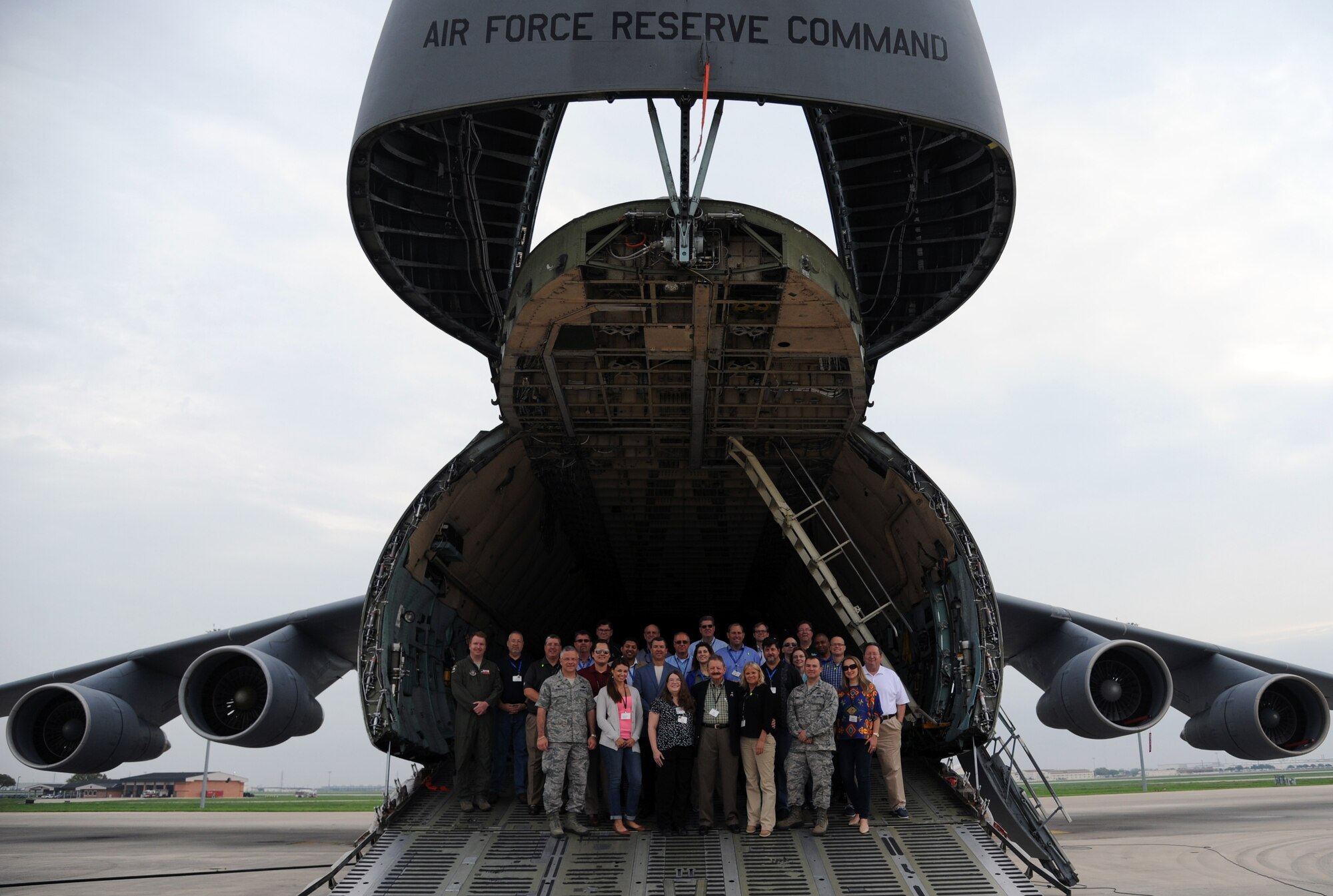 Civic leaders from the local Tampa area gathered on the front ramp of a C-5 Galaxy cargo plane for a group photograph. The civic leaders participated in 927th Air Refueling Wing, MacDill Air Force base, Fla., sponsored civic leader trip to the 433rd Airlift Wing, Joint Base San Antonio, March 19-20. Civic leader trips increase awareness of how the Air Force Reserve contributes to the total force and the importance of the 927th Air Refueling Wing to the local economy. (U.S. Air Force photo/Tech. Sgt. Peter Dean)