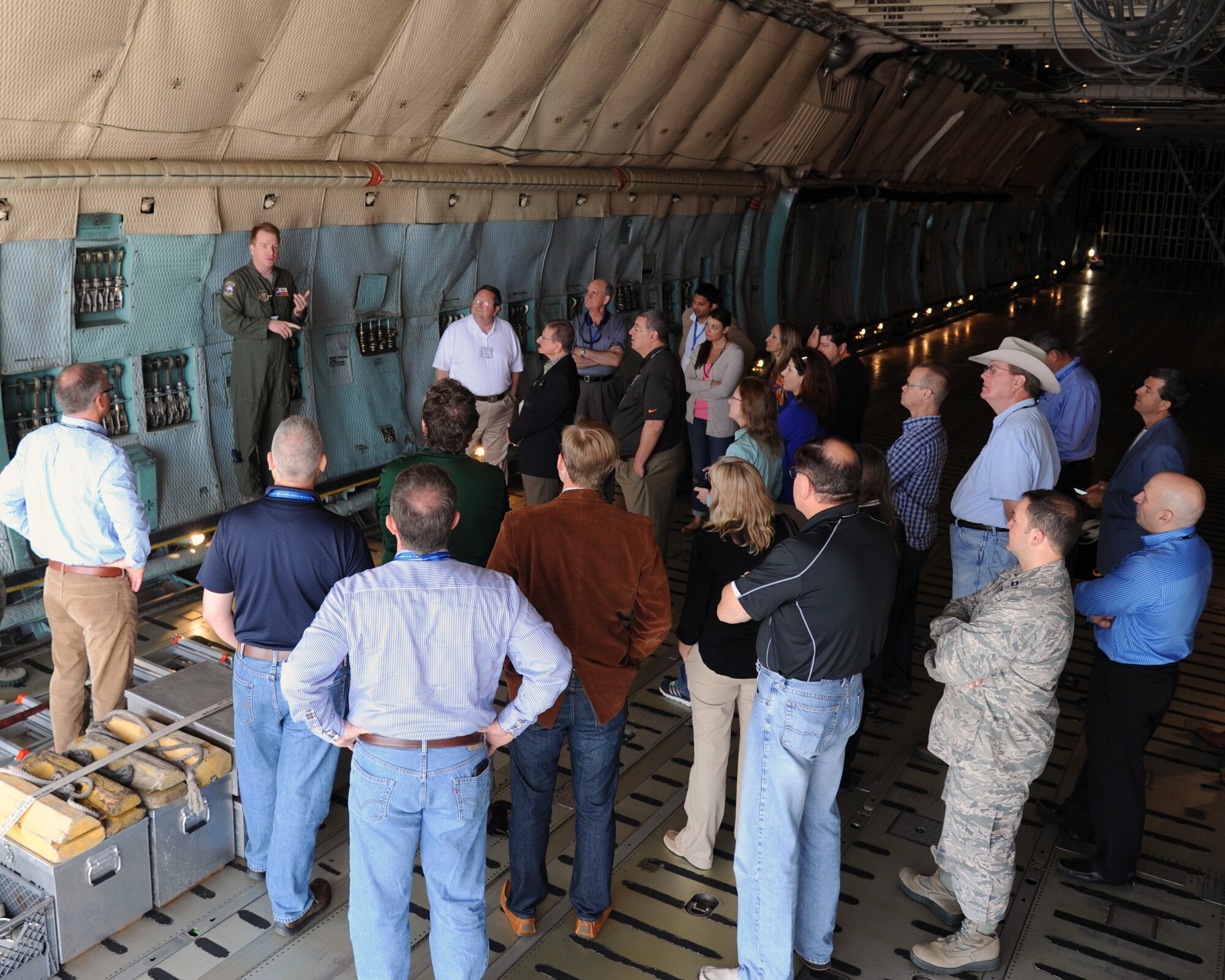 Maj. Jonathan Behunin an aircraft commander with the 433rd Airlift Wing, Joint Base San Antonio, Texas, explains to civic leaders the capabilities of a C-5 Galaxy cargo plane. The civic leaders were participating in a 927th Air Refueling Wing, MacDill Air Force Base, Fla., sponsored civic leader trip, March -19-20. Civic leader trips increase awareness of how the Air Force Reserve contributes to the total force and the importance of the 927th Air Refueling Wing to the local economy. (U.S. Air Force photo/Tech. Sgt. Peter Dean)