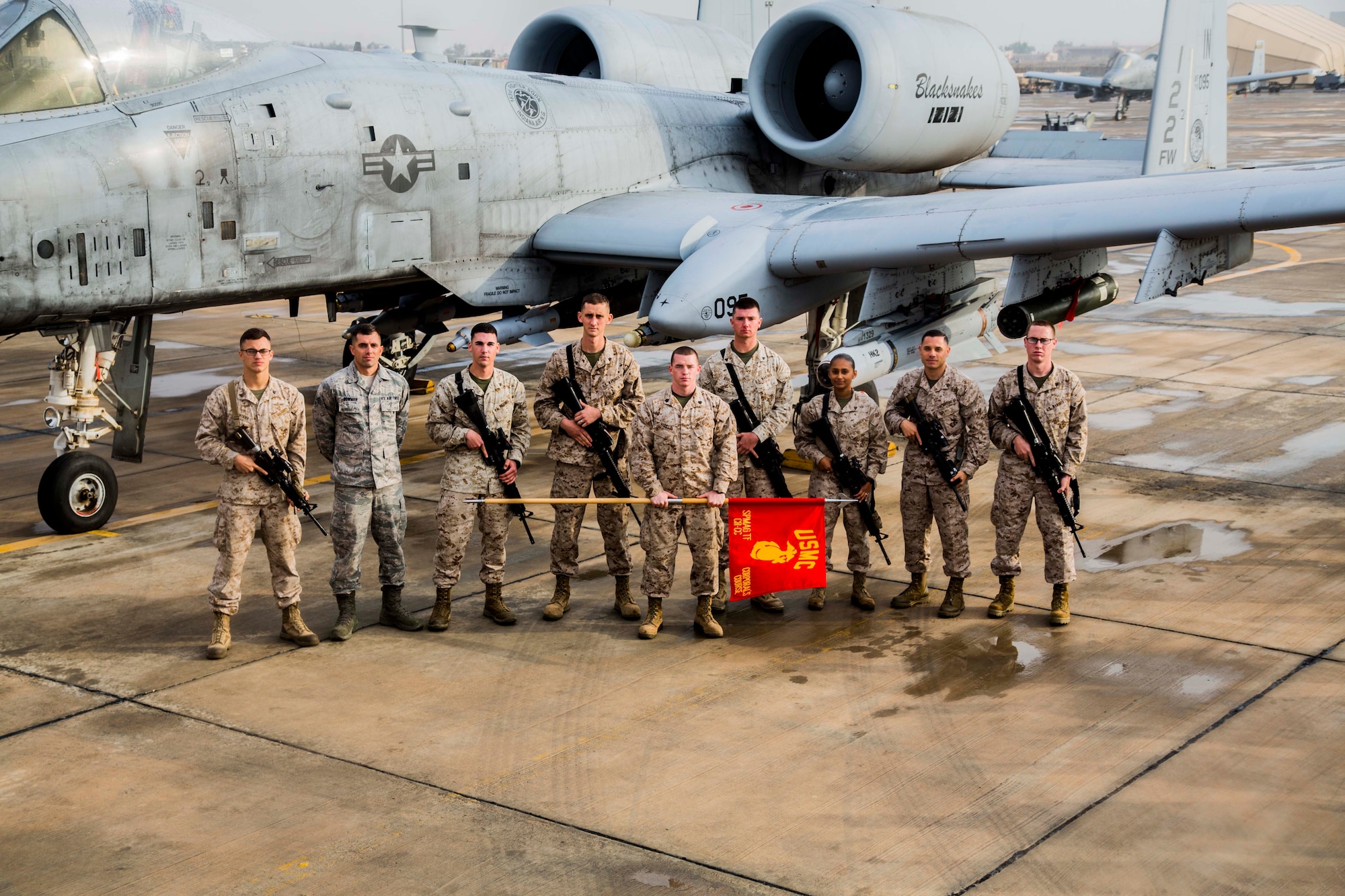 Senior Airman Nathan Bowman, 21st Force Support Squadron (second from left), is conspicuous in his Air Force uniform as he stands among fellow graduates of the Marine Corporals Leadership Course. Bowman and one other Airman were admitted to the course, which is not typical, according to Marine 1st Sgt. Jason Politte, who ran the course. Bowman attended the course Jan. 25-Feb. 19 while deployed to Southwest Asia. (Courtesy photo)