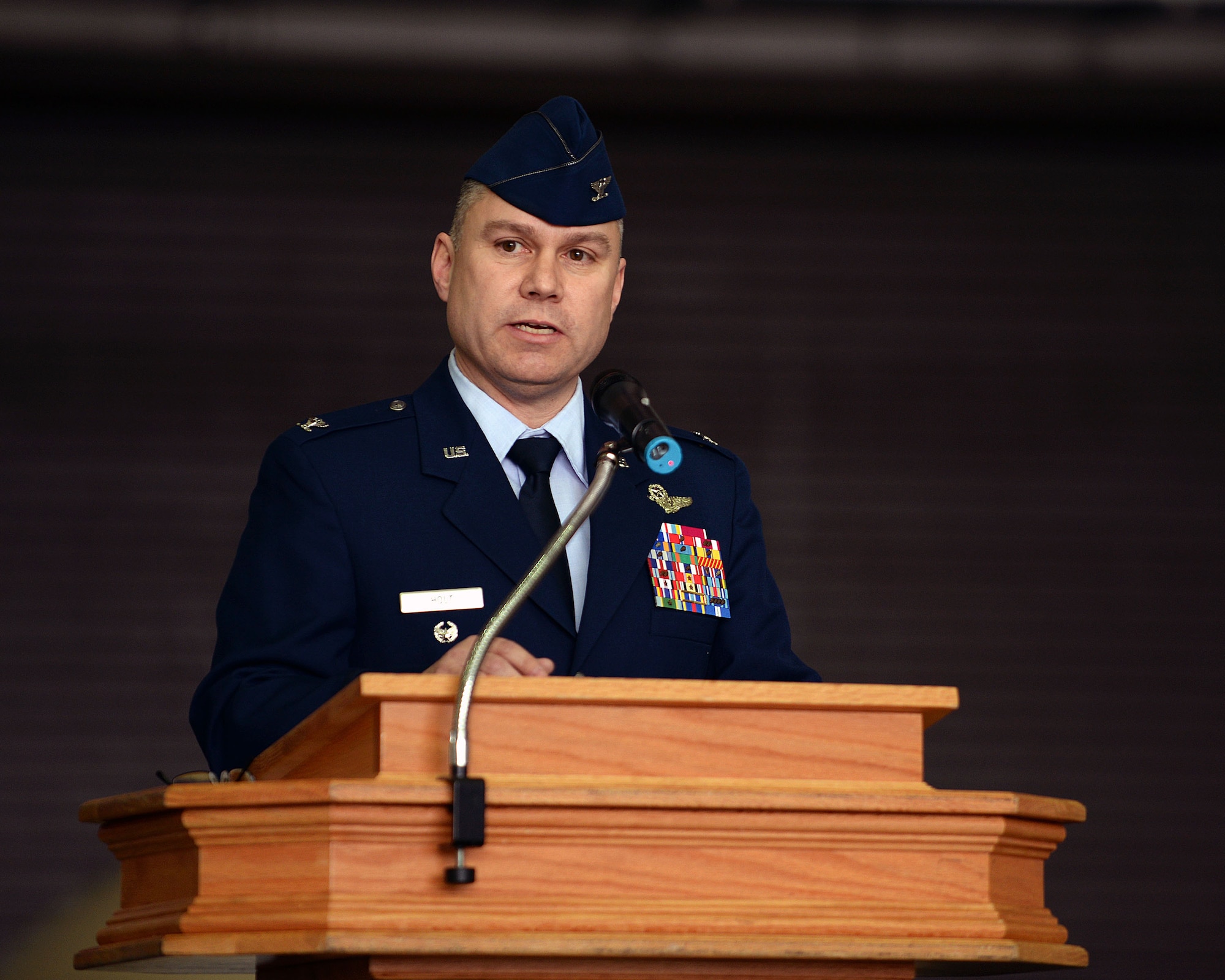 U.S. Air Force Col. William Holt, 352nd Special Operations Wing commander, speaks during the 352nd SOW activation ceremony March 23, 2015, on RAF Mildenhall, England. The 352nd SOW is comprised of more than 1,200 active-duty and civilian Airmen performing missions on MC-130J Commando II and CV-22B Osprey aircraft for AFSOC. (U.S. Air Force photo by Senior Airman Christine Griffiths)
