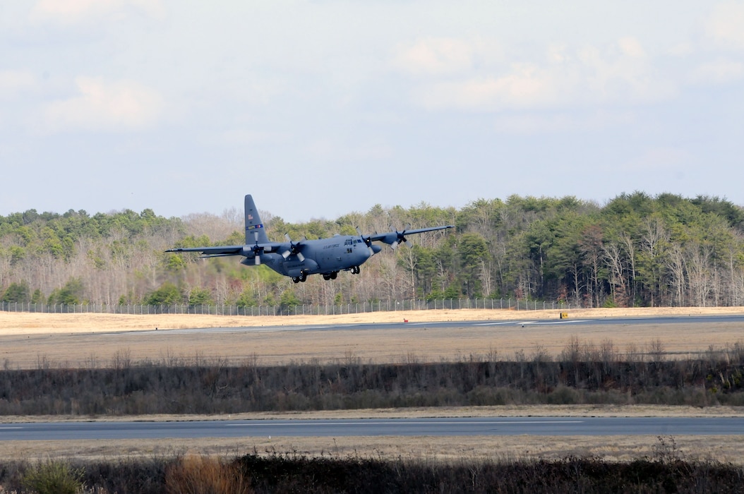 Airmen of the North Carolina Air National Guard, 145th Airlift Wing and 156th Airlift Squadron, remain mission ready as they achieve proficiency and currency training by flying maneuvers, airdrops and “Touch and Go’s” on the runways between the 145th Civil Engineer Squadron-Regional Training Site and the North Carolina Air National Guard Combat Operations Group based in New London, N.C. March 4, 2015. (U.S. Air National Guard photo by Master Sgt. Patricia F. Moran, 145th Public Affairs/Released)