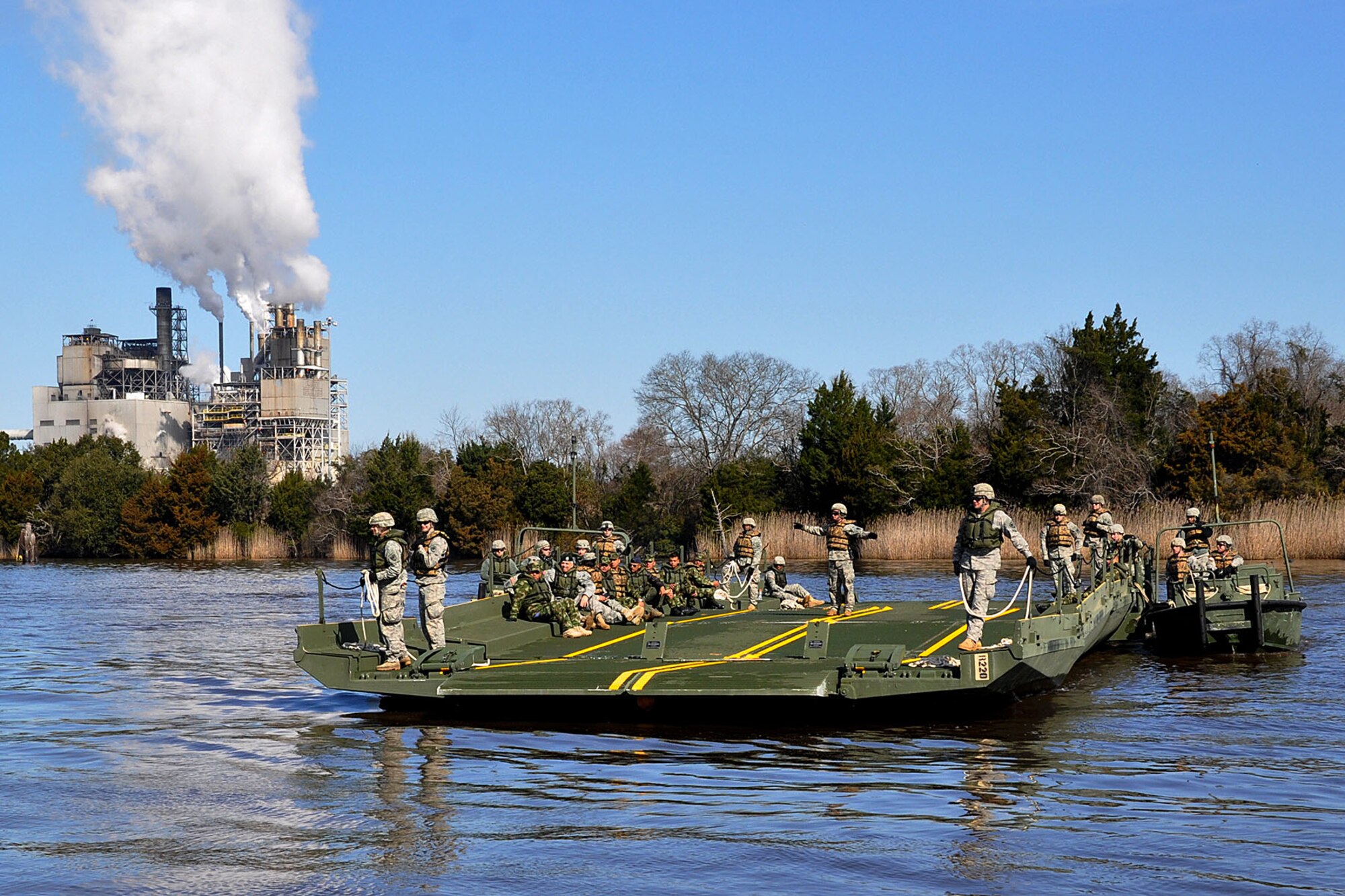 U.S. Army Engineers with the South Carolina Army National Guard’s 125th Multi-Role Bridge Company (MRBC) conduct simulated ferry operations March 7, 2015 during Vigilant Guard 15. This exercise is designed to simulate a joint emergency response following the impact of a category four hurricane.  Hundreds of Georgia National Guardsmen are participating in Vigilant Guard 15 along with more than 2,000 Guardsmen from North and South Carolina during 3 to12 March. Vigilant Guard is a series of federally-funded disaster-response drills conducted by National Guard units working with federal, state and local emergency management agencies and first responders. (U.S. Army National Guard photo by Capt. William Carraway/Released)