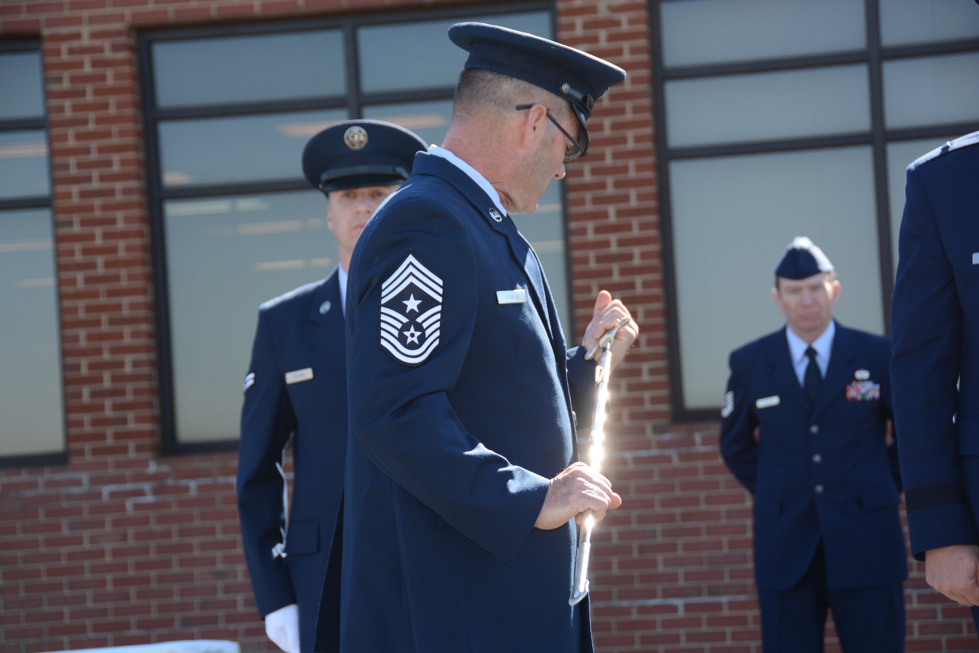 U.S. Air Force State Command Chief Master Sgt. Michael D. Stanley, accepted the position of the highest enlisted airman in the North Carolina Air National Guard, as he inspects the non-commissioned officer’s sword during a Change of Authority ceremony held at the North Carolina Air National Guard base, Charlotte Douglas Int'l. Airport, Feb. 8, 2015. (U.S. Air National Guard photo by Master Sgt. Rich Kerner, 145th Public Affairs/Released)