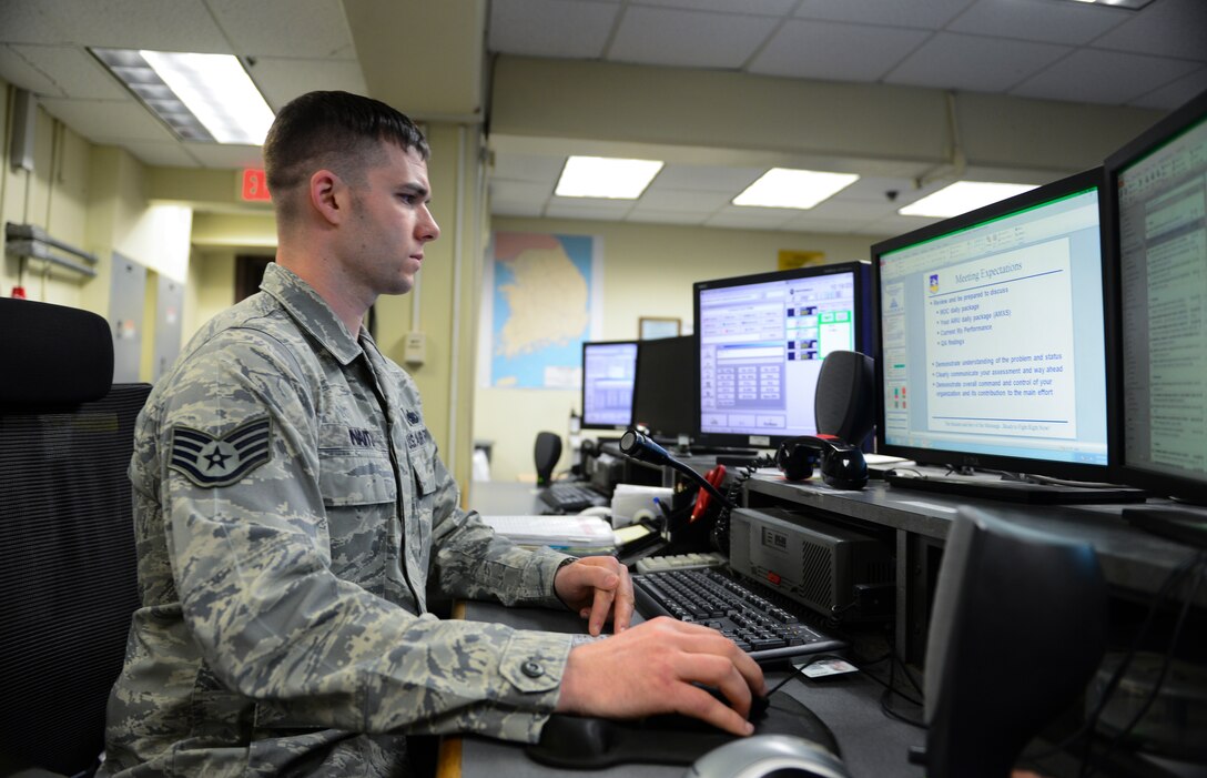 Staff Sgt. Gordon Waits, 51st Maintenance Operations Flight maintenance operations center senior controller, updates information on aircraft status for a slideshow briefing March 20, 2014, at Osan Air Base, Republic of Korea. Waits is this week’s Team Osan Spotlight winner. (U.S. Air Force photo by Senior Airman David Owsianka)