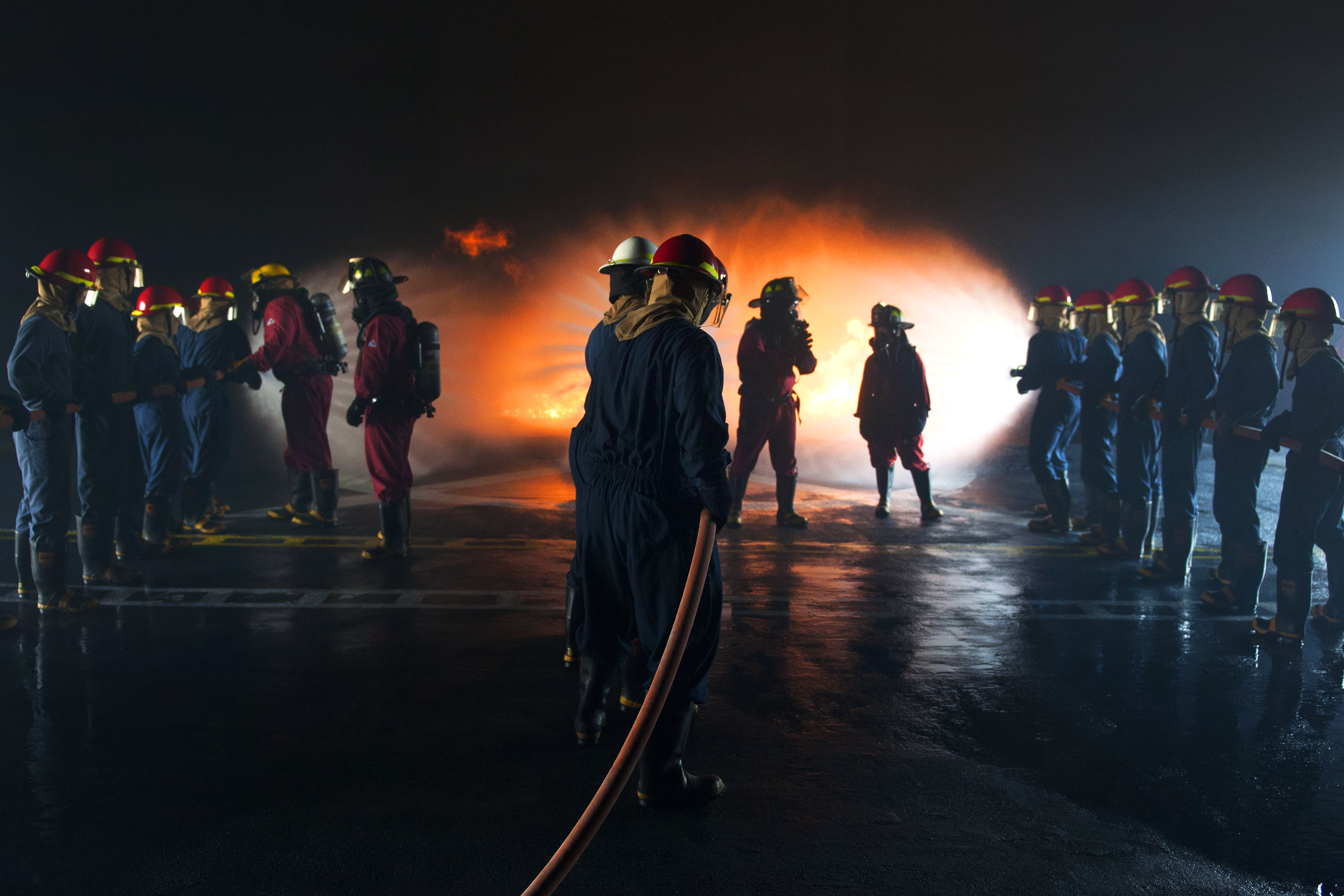 Sailors participate in general shipboard firefighting training at the
