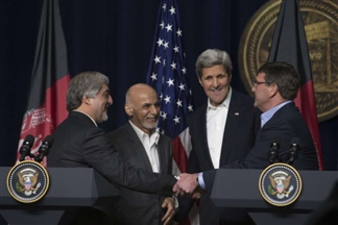 From right to left: U.S. Defense Secretary Ash Carter, Secretary of State John Kerry, Afghan President Ashraf Ghani and Chief Executive Abdullah Abdullah shake hands following a joint press conference on Camp David, Md., March 23, 2015.