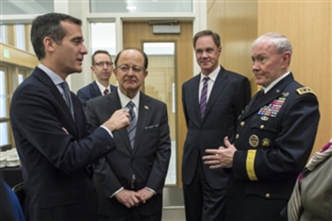 Army Gen. Martin E. Dempsey, chairman of the Joint Chiefs of Staff, talks with Los Angeles Mayor Eric Garcetti, left, and University of Southern California President C.L. Max Nikias, center left, while attending a forum on local veterans issues at the university in Los Angeles, March 23, 2015.