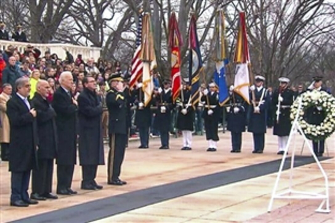 U.S. Defense Secretary Ash Carter, second from right, attends a wreath-laying ceremony with, left to right, Afghan Chief Executive Abdullah Abdullah, President Ashraf Ghani and U.S. Vice President Joe Biden at the Tomb of the Unknown Soldier at Arlington National Cemetery in Arlington, Va., March 24, 2015.
