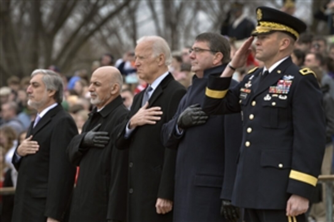 U.S. Defense Secretary Ash Carter, second from right, with, from left, Afghan Chief Executive Abdullah Abdullah, Afghan President Ashraf Ghani and Vice President Joe Biden participate in a wreath-laying ceremony at the Tomb of the Unknown Soldier at Arlington National Cemetery in Arlington, Va., March 24, 2015.  
