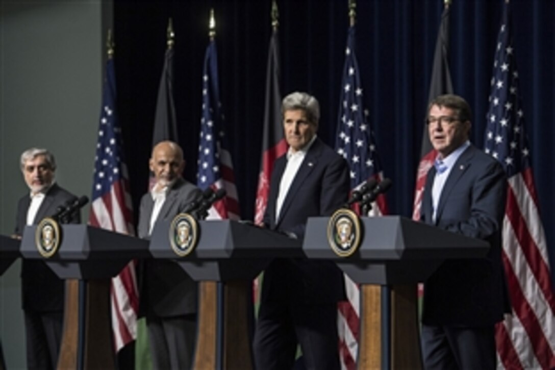 U.S. Defense Secretary Ash Carter, right, speaks during a joint press conference with, left to right, Afghan Chief Executive Abdullah Abdullah, Afghan President Ashraf Ghani and U.S. Secretary of State John F. Kerry on Camp David, Md., March 23, 2015. 