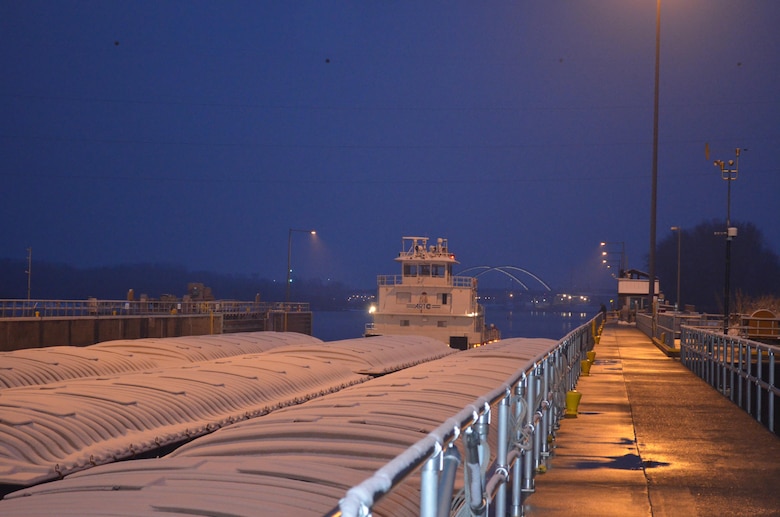 M/V New Dawn broke through Lake Pepin ice overnight and locked through Lock and Dam 2, near Hastings, Minnesota, around 7:45 on March 25, 2015, marking the unofficial start to the navigation season for the Upper Mississippi River. The American River Transportation Company boat was pushing nine barges loaded with fertilizer.