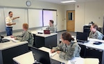 Soldiers with the Georgia National Guard’s 560th Battlefield Surveillance Brigade receive instruction in Persian-Farsi from a native instructor at the Georgia Guard’s new Language Center at Clay National Guard Center.