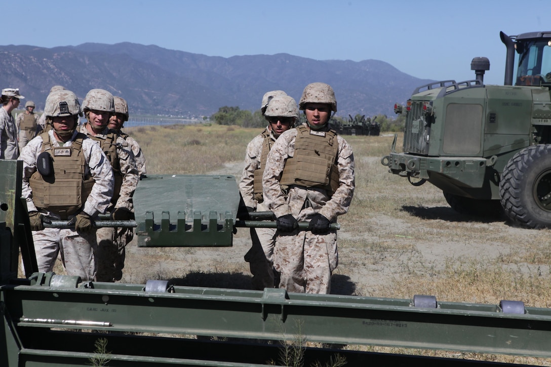 Marines from Bridge Company, 7th Engineer Support Battalion, 1st Marine Logistics Group, conduct a bridge exercise at Lake Elsinore, Calif., March 24. Marines built an Improved Ribbon Bridge and a Medium Girder Bridge.